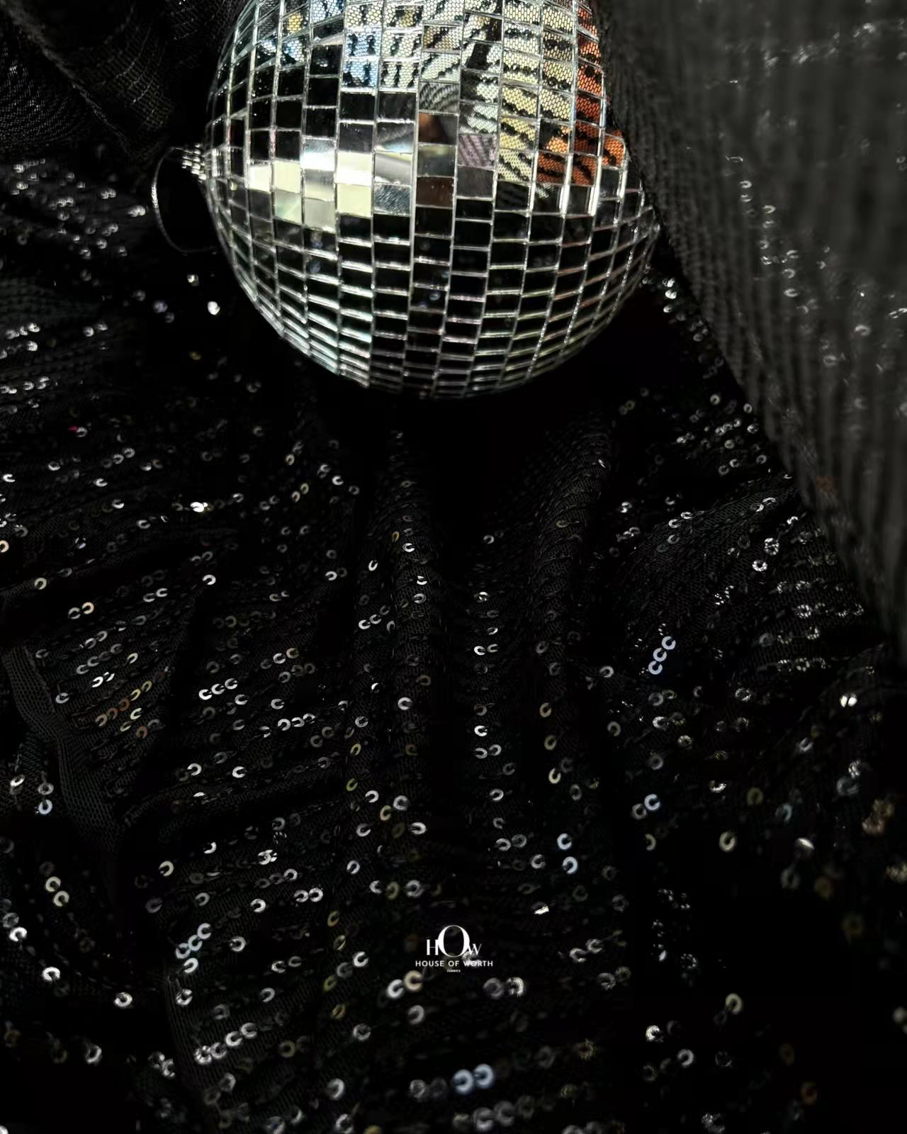 Glossy sequins fabric also known as Zara sequins, used for party gowns by Delhi fabric suppliers.