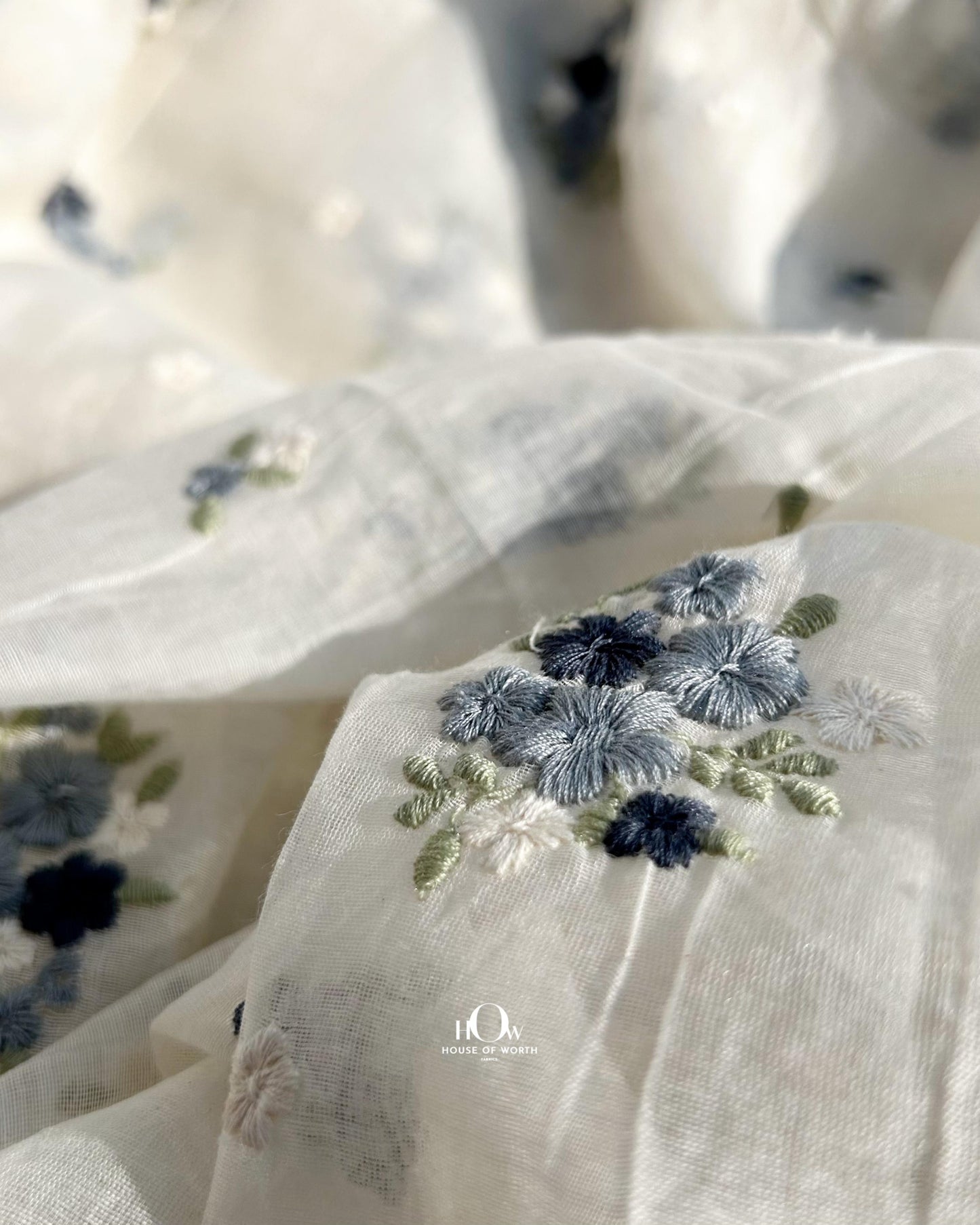 Premium dyeable Chanderi fabric with floral motifs – available in off-white base from suppliers in Surat, Varanasi, and Delhi.