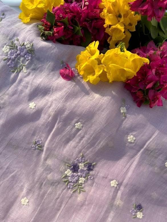 Lavender Mul Chanderi fabric with floral butti embroidery – ideal for suits, sarees, and festive wear.