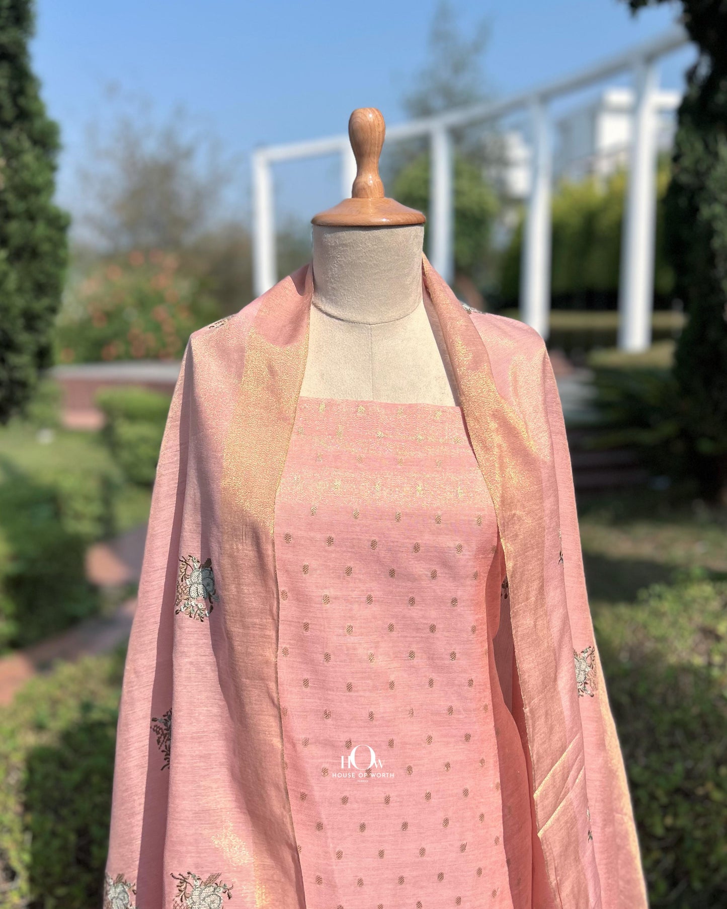 Peach formal cotton tissue suit for women featuring silver zari patterns
