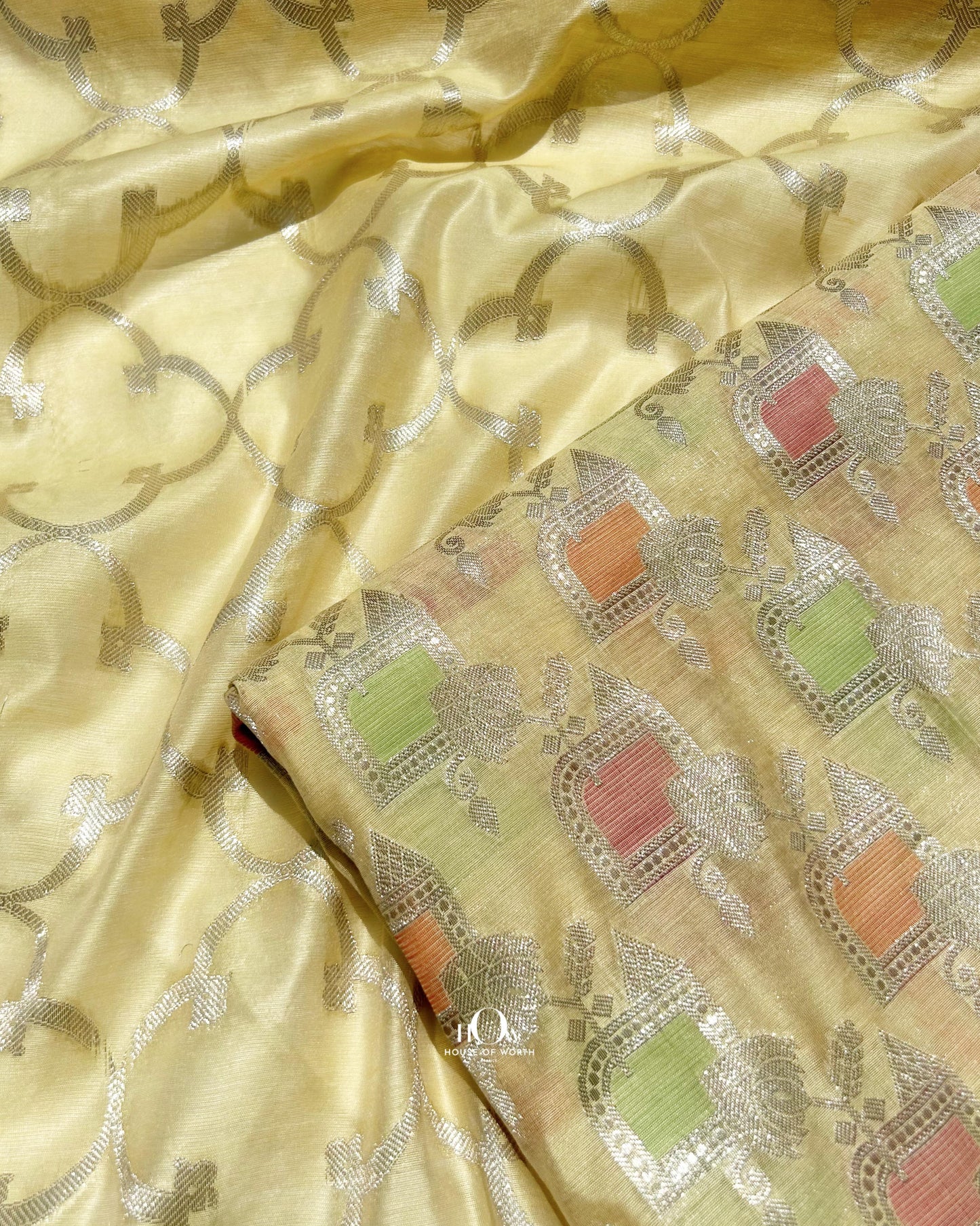 Yellow Banarasi suit with silver zari work design and matching dupatta