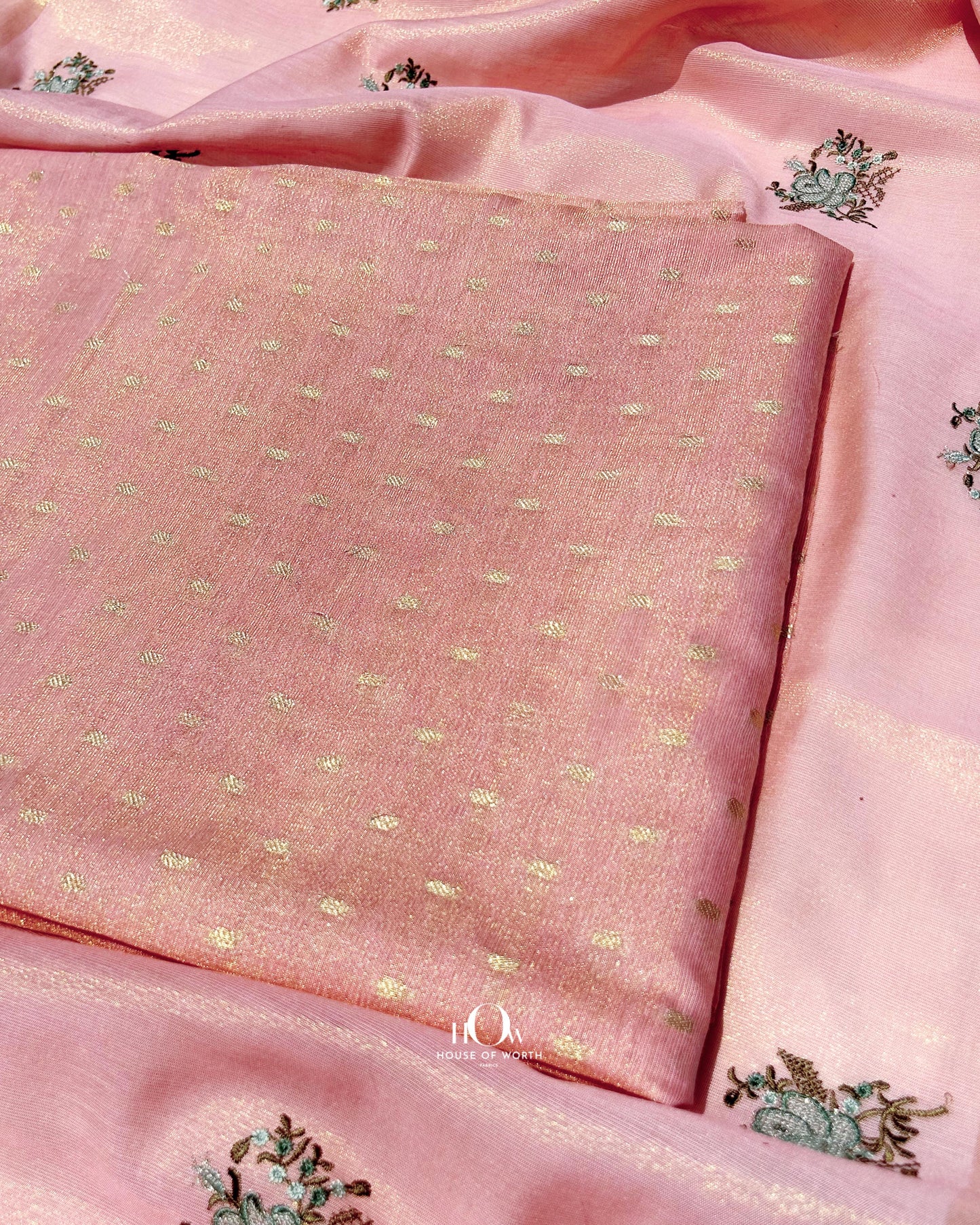 Unstitched cotton tissue suit in peach with pastel motif kurta, bottom, and dupatta