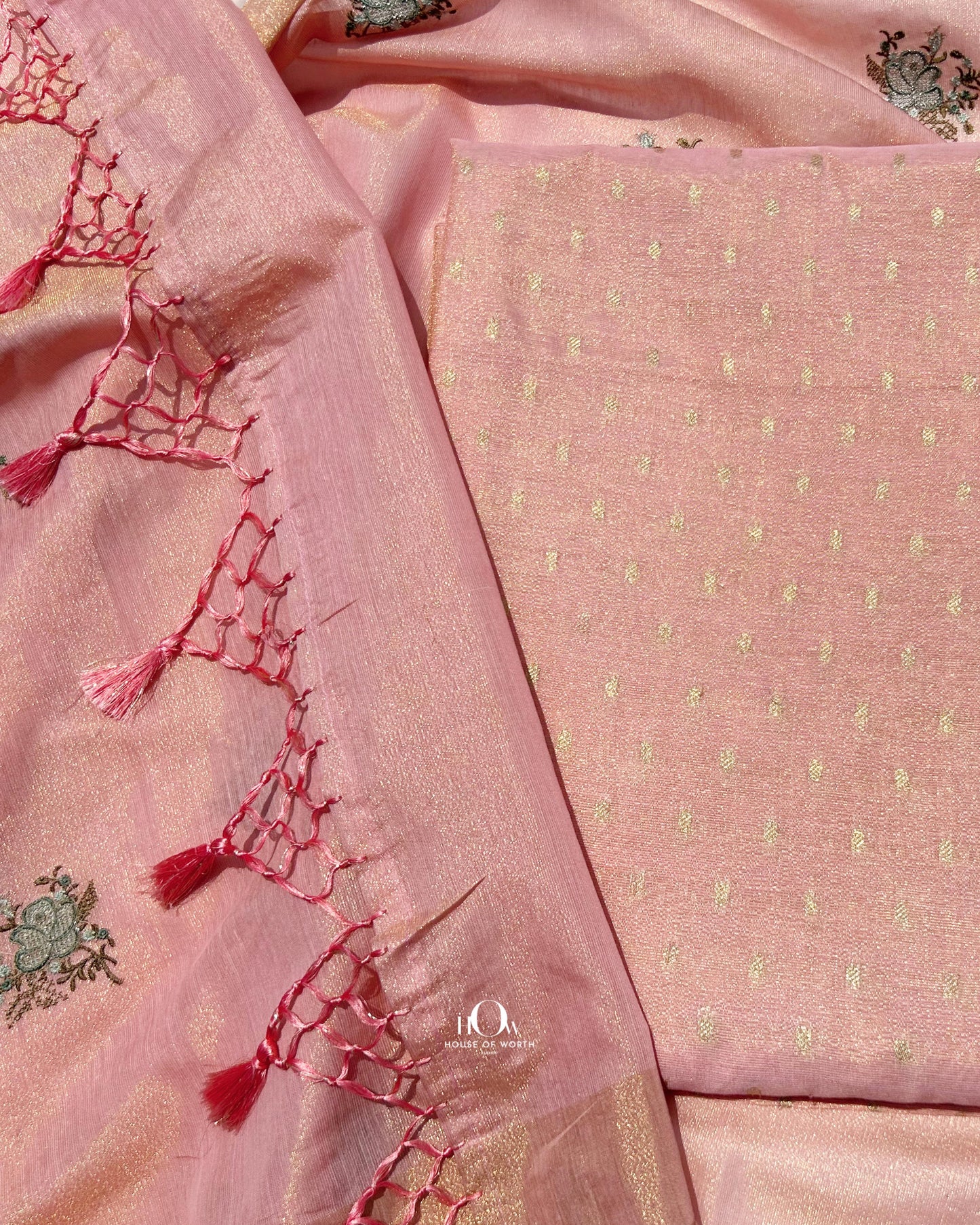 Breathable Banarasi cotton-tissue suit, peach tone with gold and silver zari detailing.