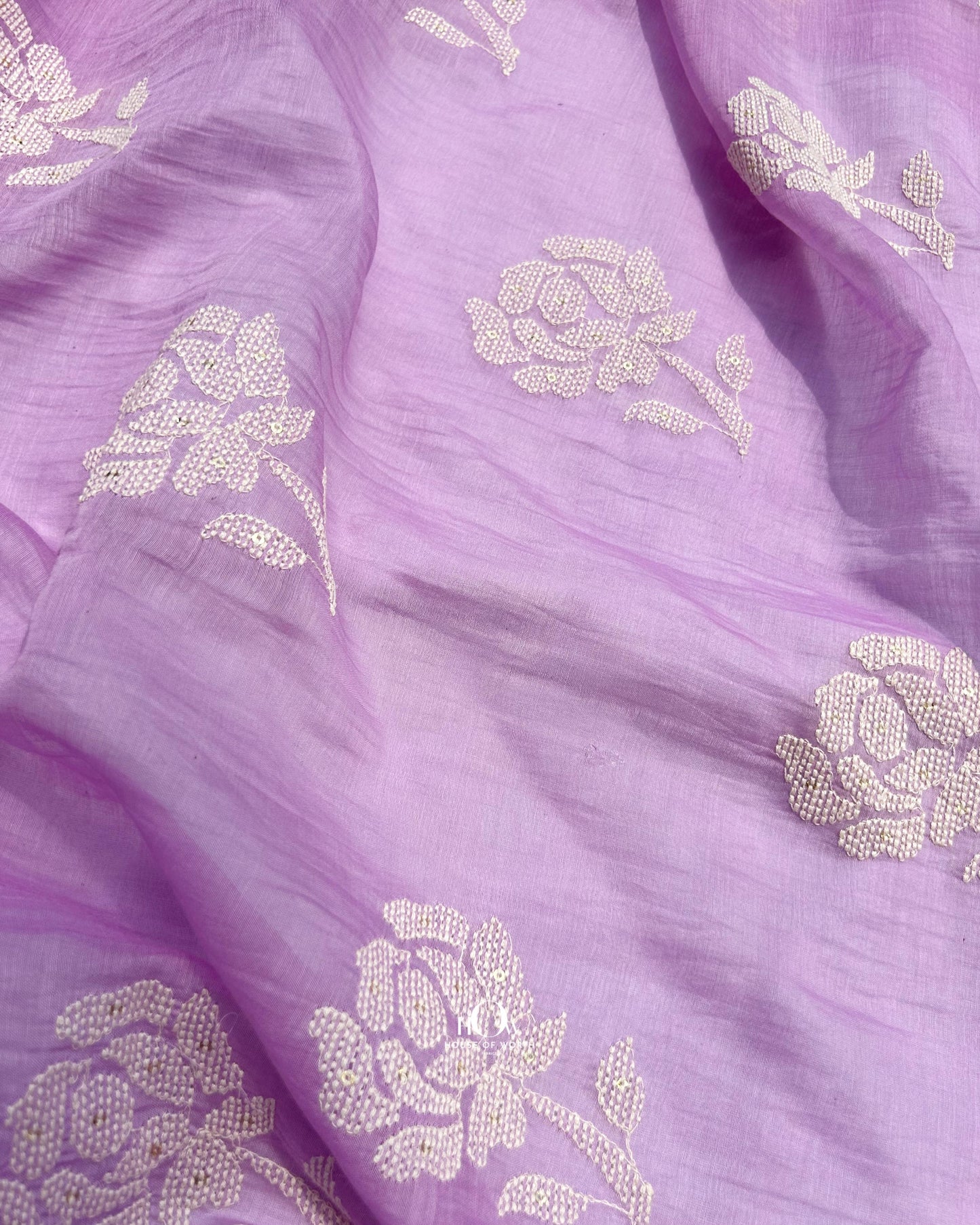 Soft handloom Chanderi fabric for sarees and kurtis – traditional weave with delicate detailing.