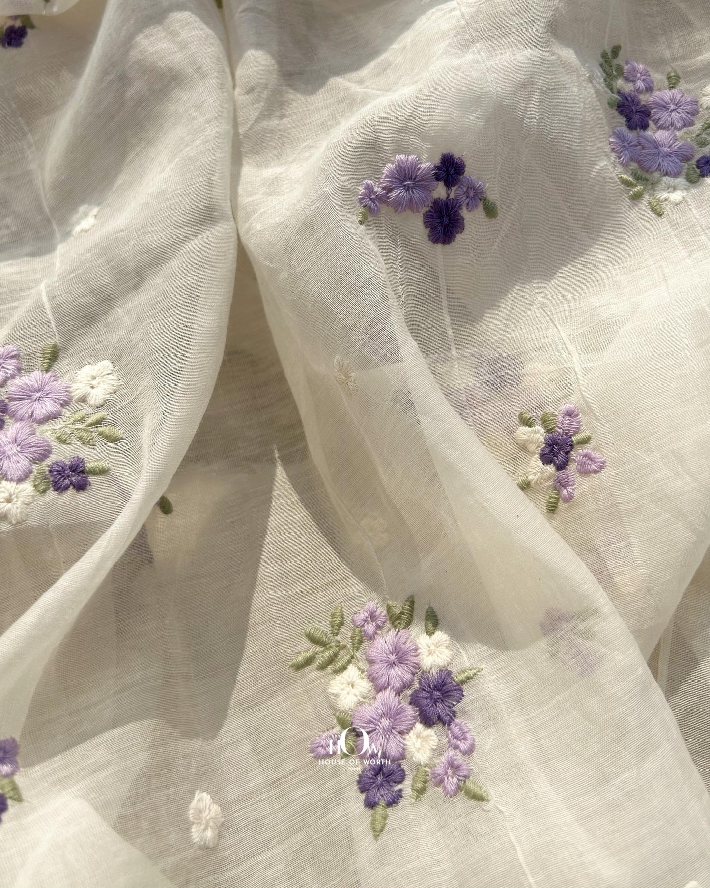 Wholesale supplier of dyeable Pure Chanderi fabric – off-white base with thread embroidered purple buttas, available in Delhi and Surat.