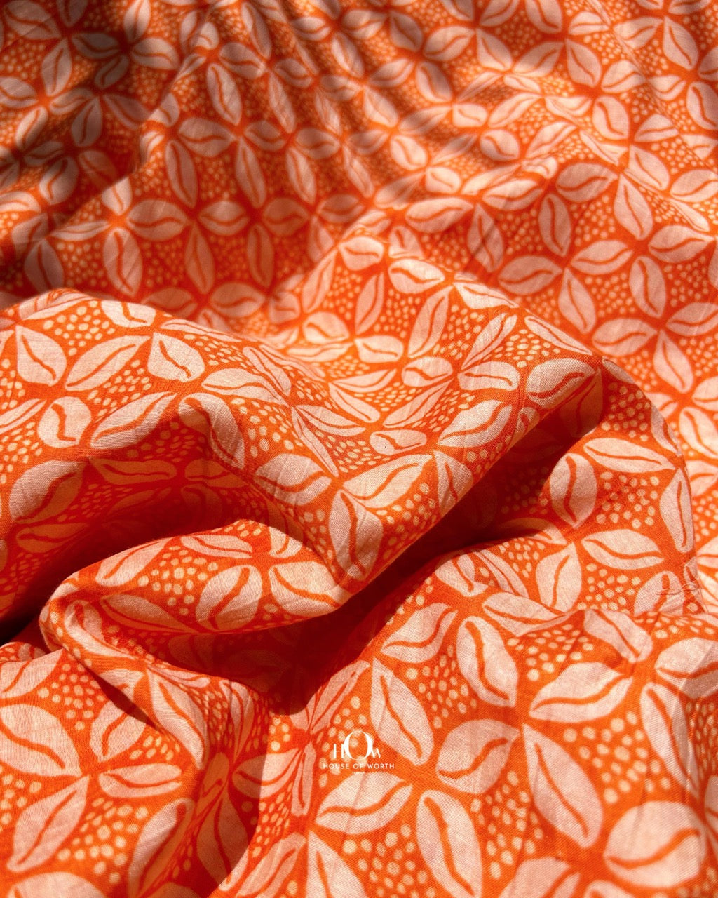 Printed Mul Chanderi fabric in vibrant orange – ideal for Indian dresses, suits, and casual ethnic styling.