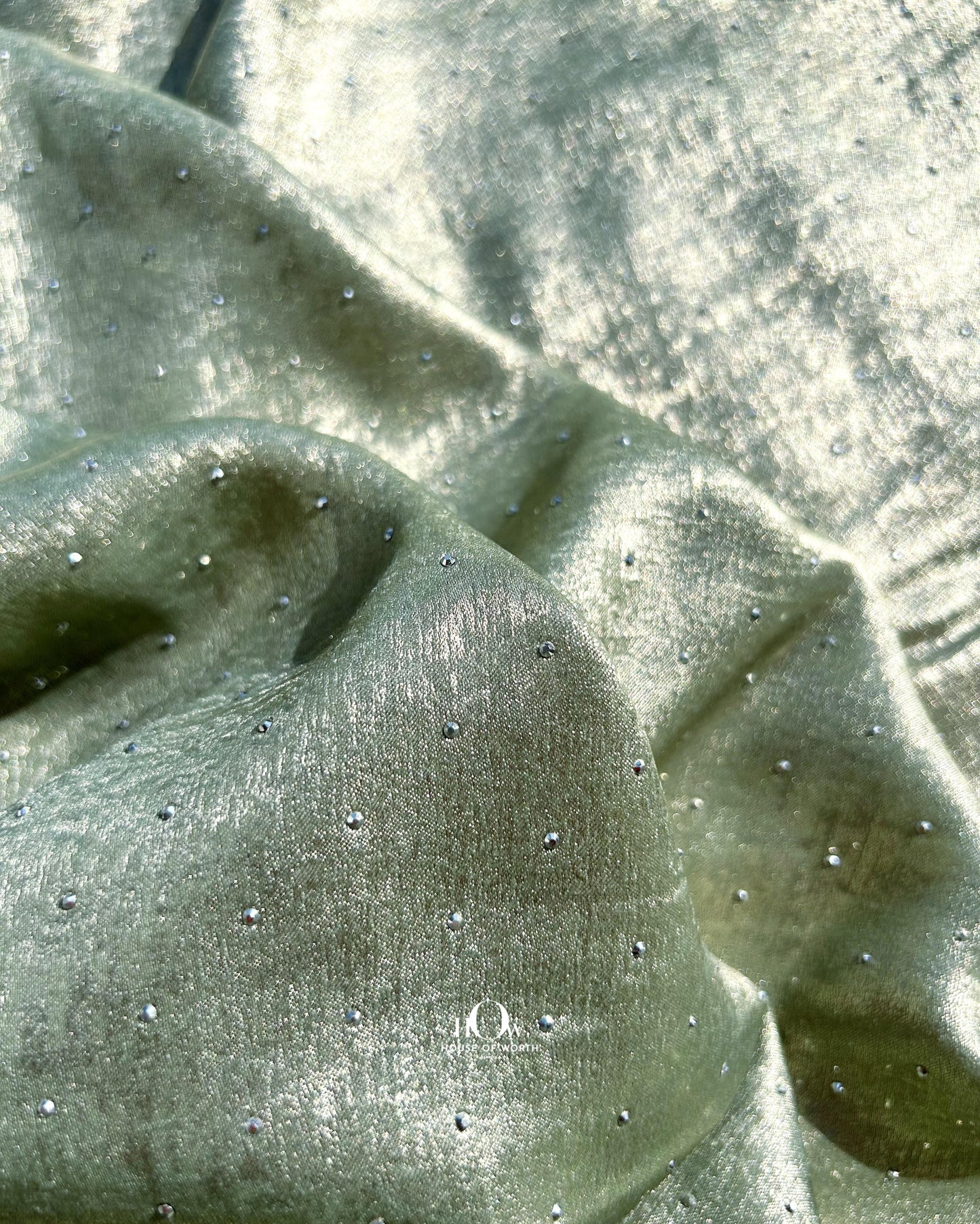 Wholesale rhinestone fabric with Swarovski-style shine – sourced from Surat for designer outfits.