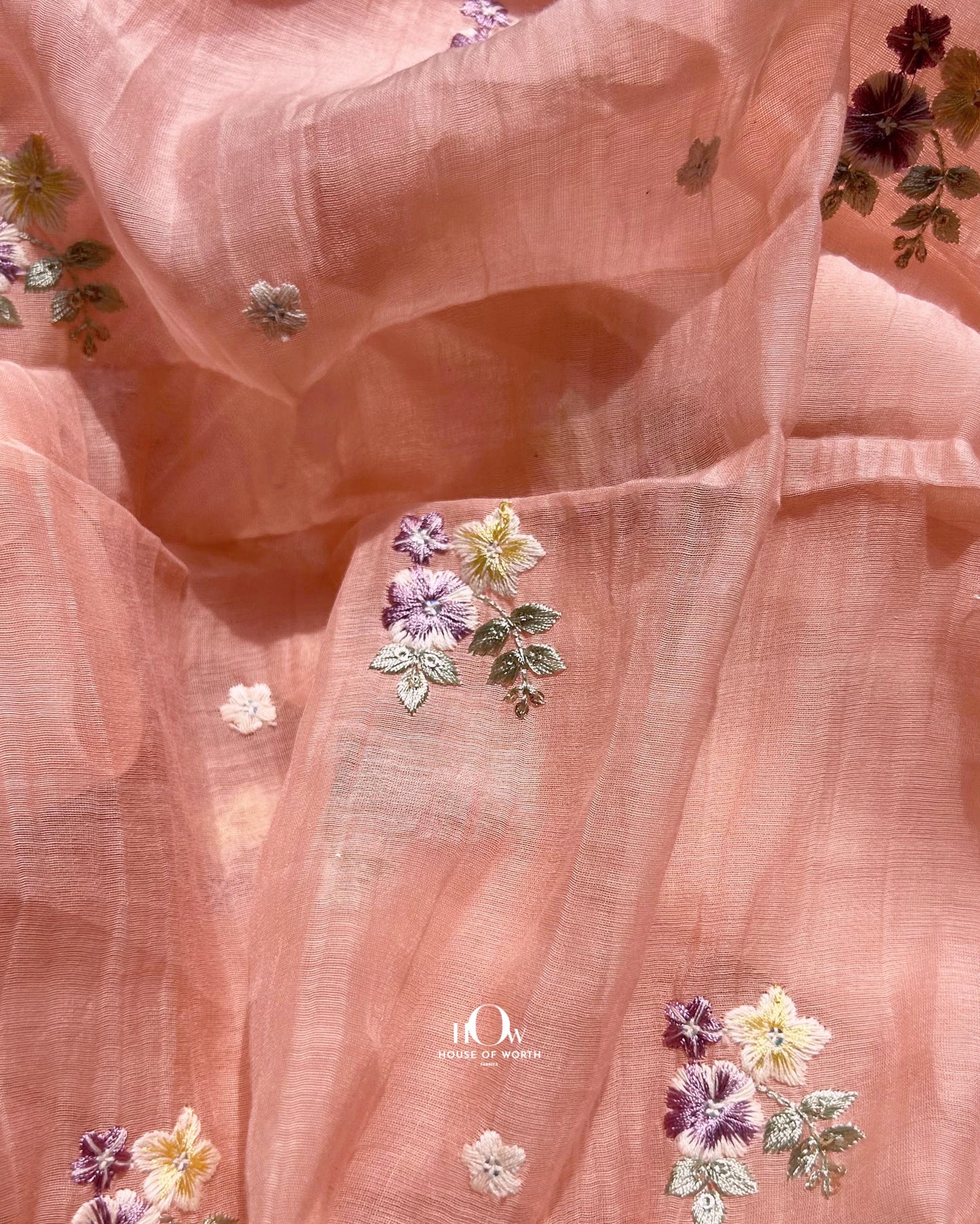 Peach Mul Chanderi dress material with delicate multi-shade floral buttas – sourced from Surat, Delhi, and Varanasi.