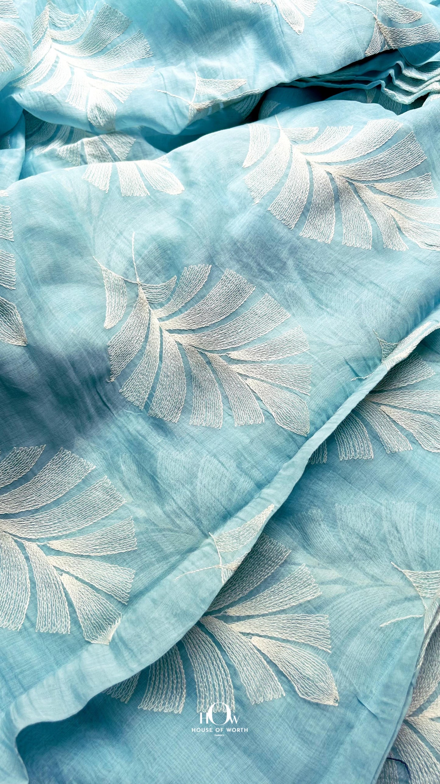 Buy crinkle finish Mul Chanderi fabric in sky blue – soft and breathable fabric perfect for boutique and designer collections.