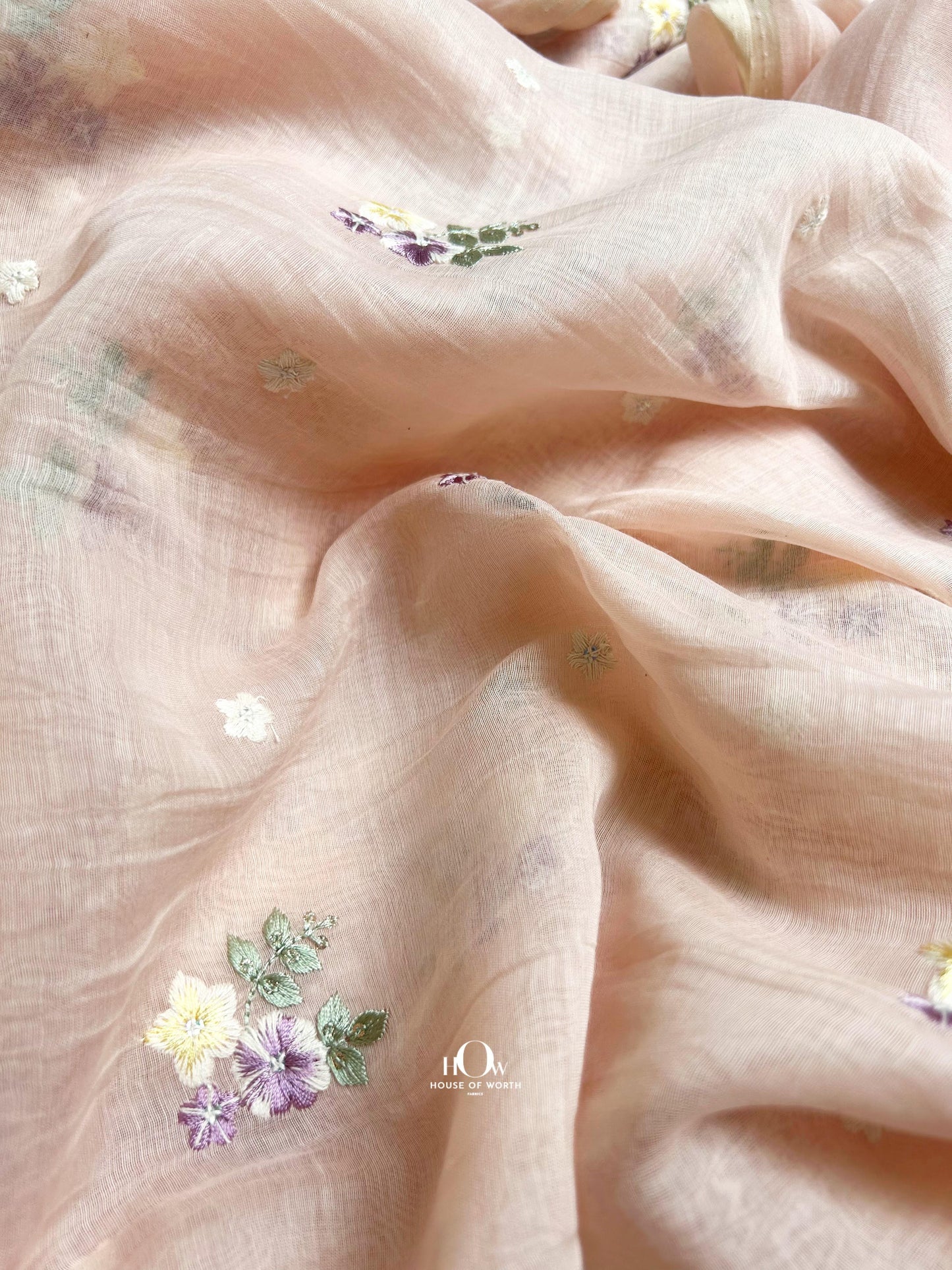 Handwoven peach Mul Chanderi fabric with thread floral work – available from trusted suppliers in Surat, Delhi, and Varanasi.