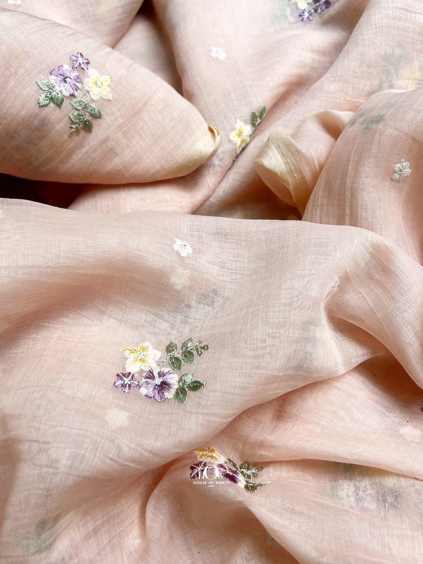 Premium quality pastel floral embroidered Mul Chanderi fabric – breathable, semi-sheer, and sourced from Banaras and Surat.