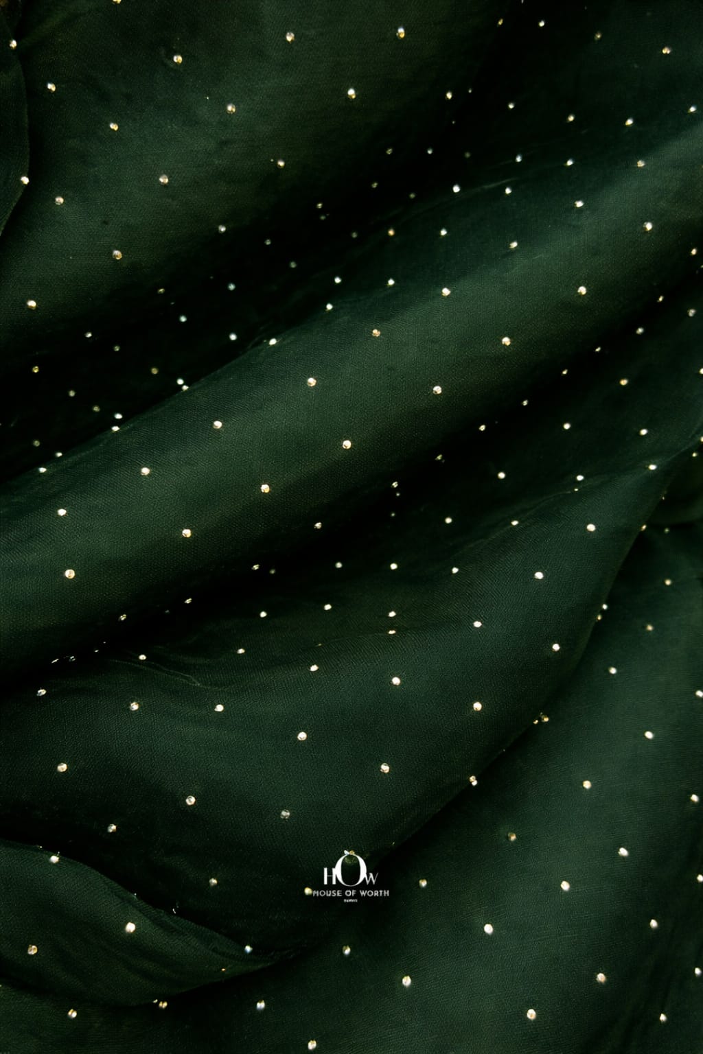 Emerald-green organza cloth ideal for bridal lehengas and evening gowns