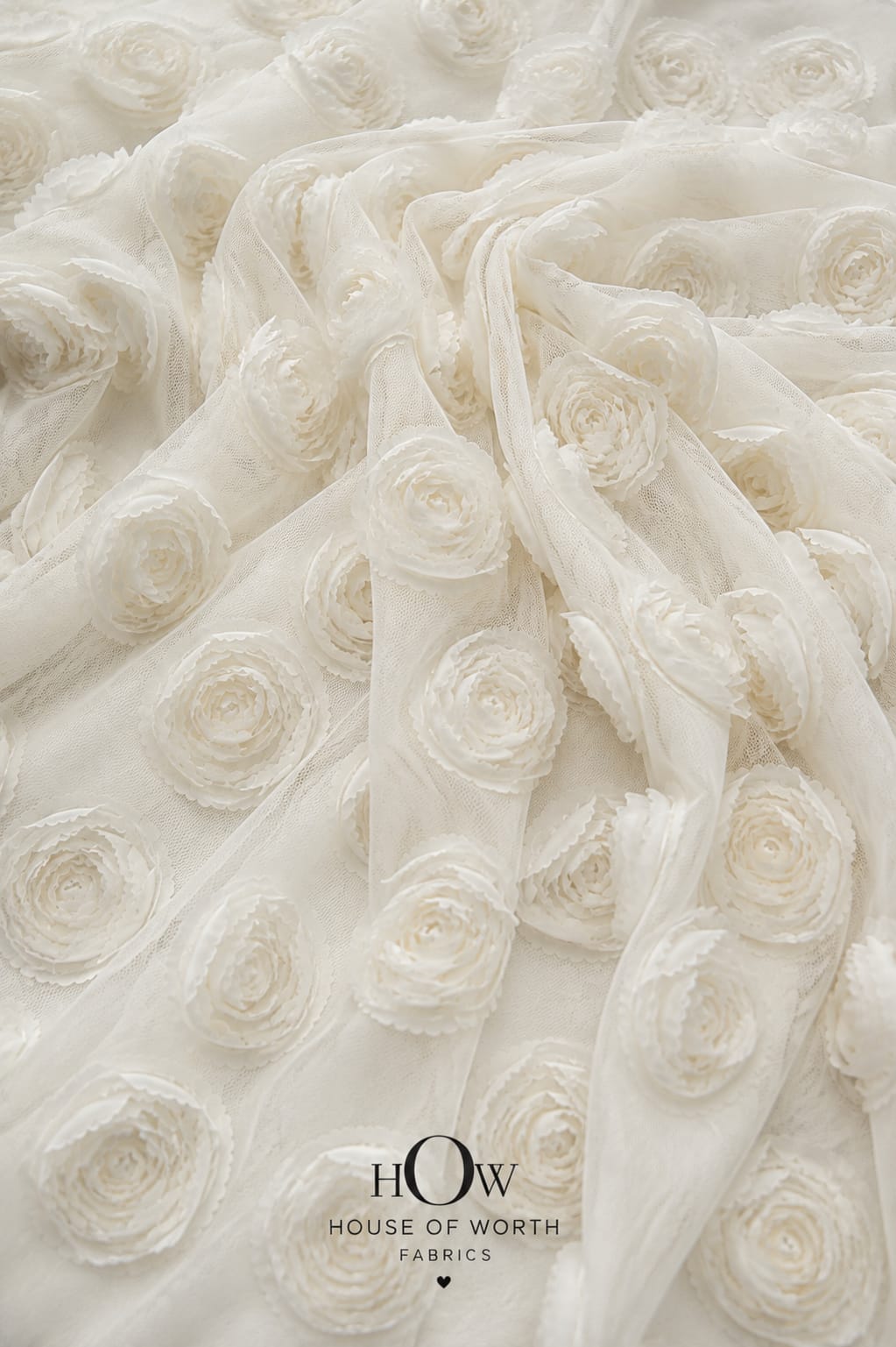 Ivory white all-over 3D floral net fabric for bridal gowns and couture
