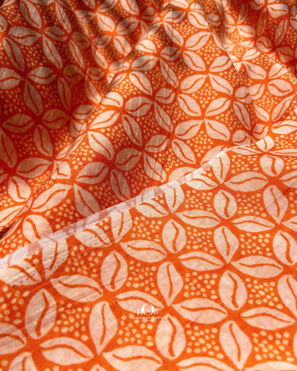 Pure Chanderi fabric with orange and white leaf print – breathable and elegant fabric for summer ethnic wear.