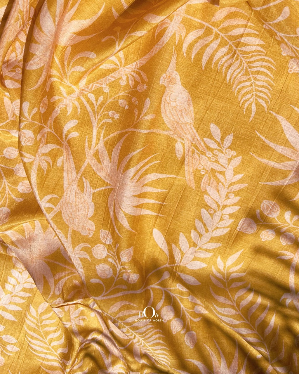 Soft yellow Mul Chanderi fabric with all-over print – ideal for kurtis, salwar suits, and Indian dresses.