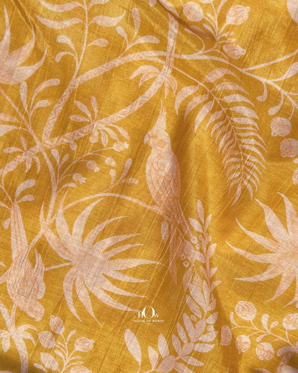 Printed Malai Chanderi fabric in yellow – lightweight fabric with nature-inspired print for festive wear.
