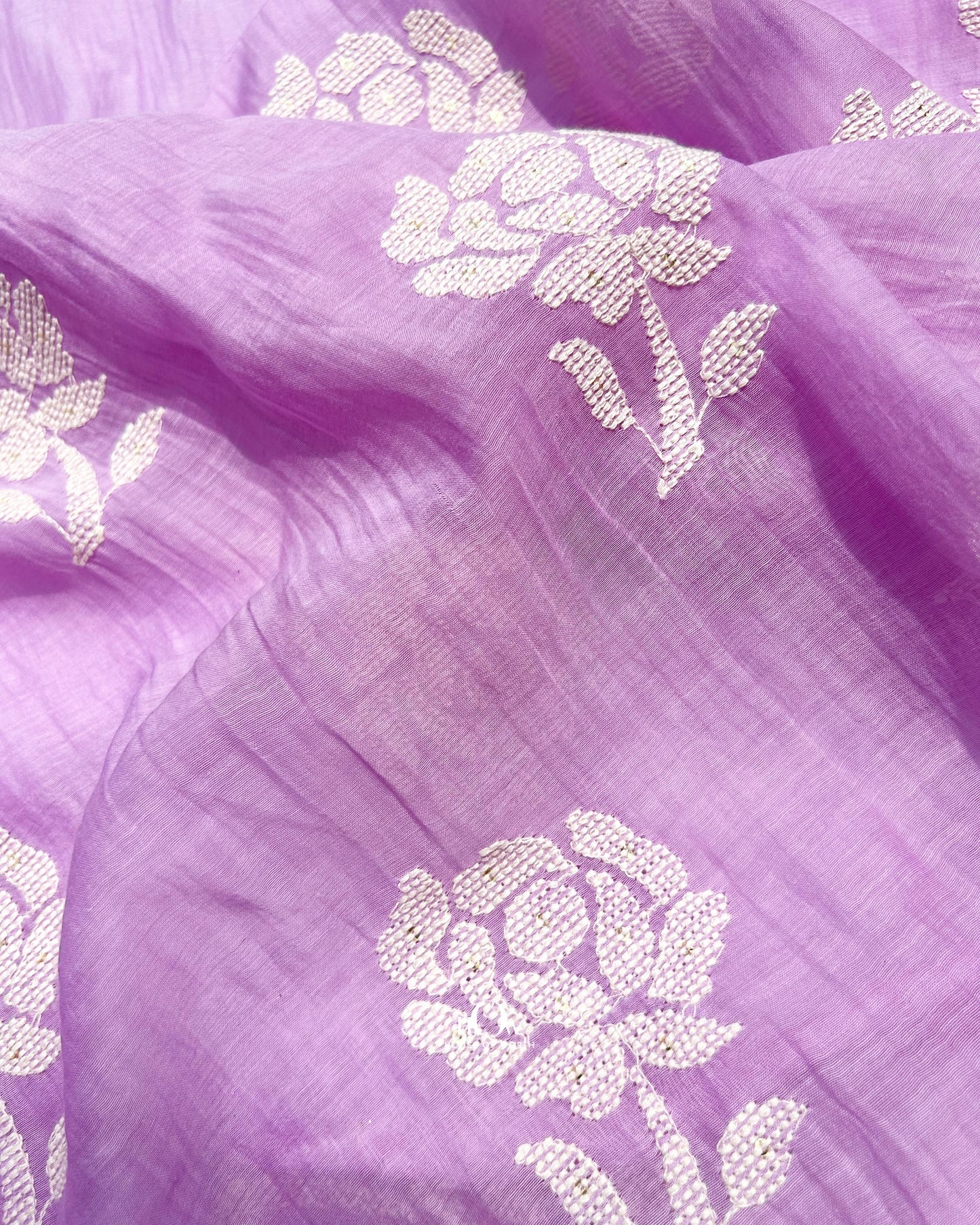 Pastel lavender handwoven Chanderi fabric ideal for festive wear, designer sarees, and ethnic suits.