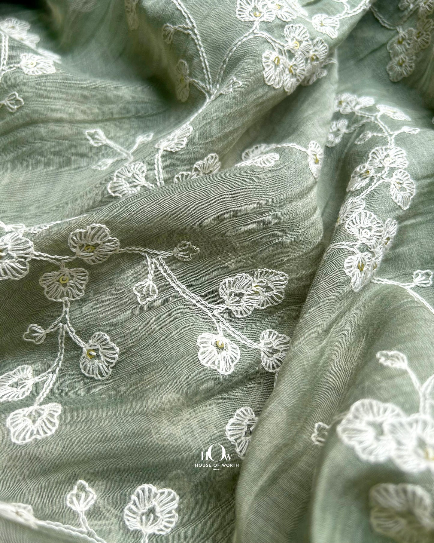 Buy embroidered Mul Chanderi fabric wholesale in Delhi, Surat, and Banaras – pastel green fabric for ethnic tailoring.