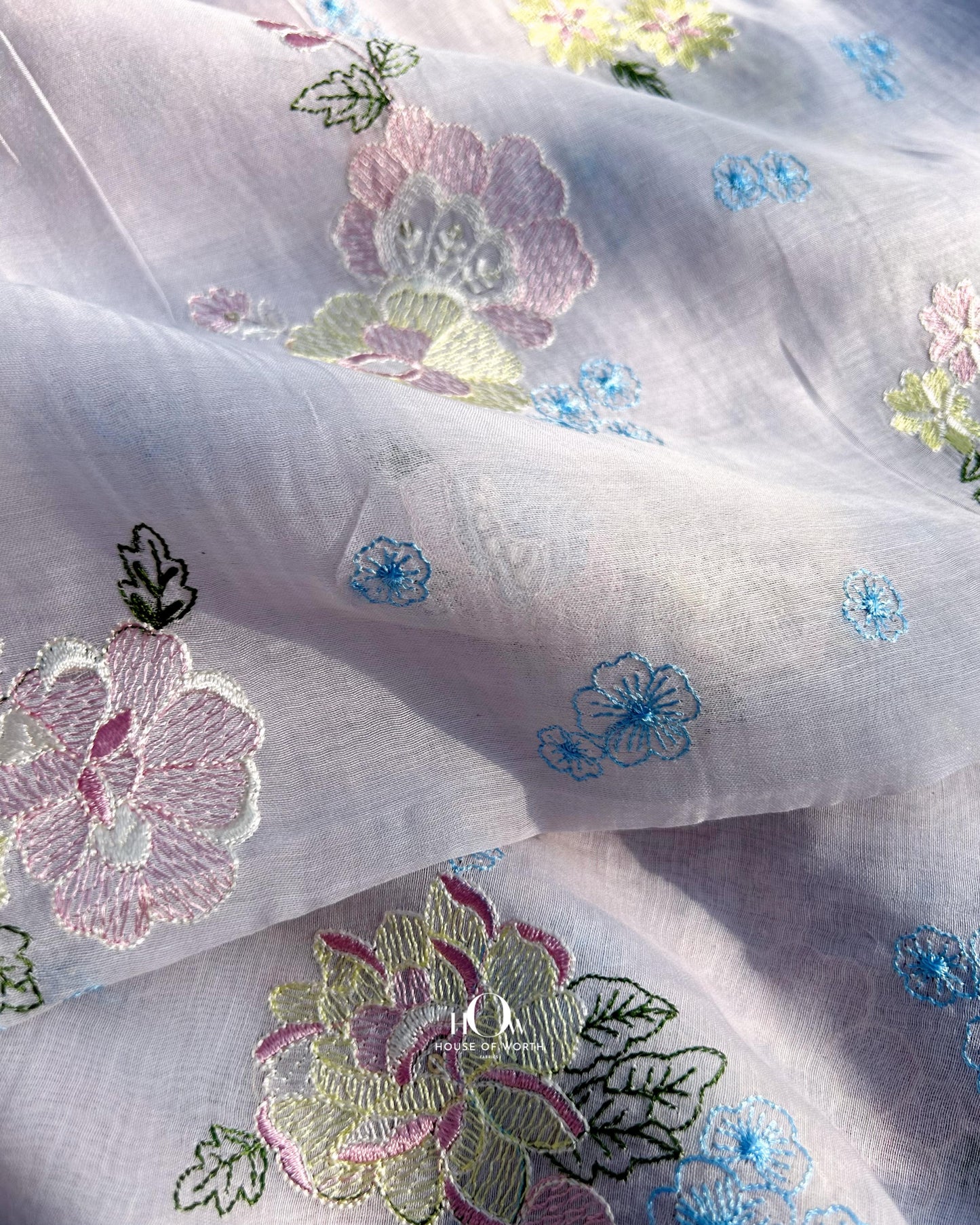 Buy pure Mul Chanderi fabric with delicate floral threadwork – lightweight lavender fabric for boutiques and tailors.