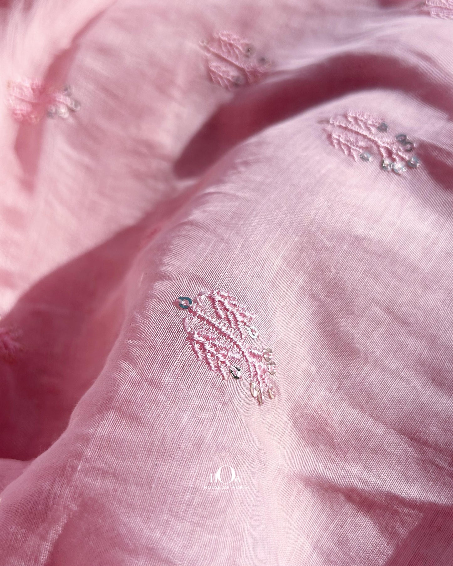 Delicate handloom Chanderi fabric in pastel pink – embroidered with small buttas, available for retail and wholesale buyers.