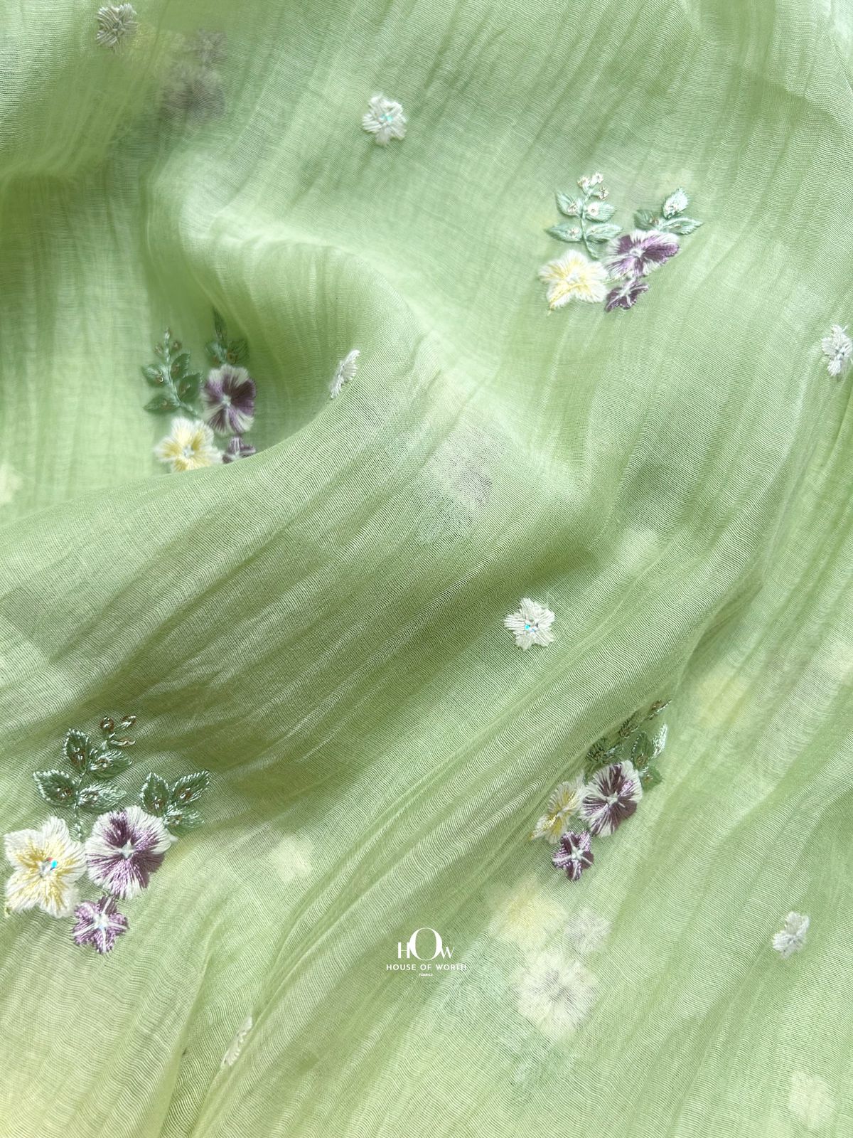 Buy floral embroidered Pure Mul Chanderi fabric in pistachio tone – breathable and elegant, available for wholesale and retail orders.