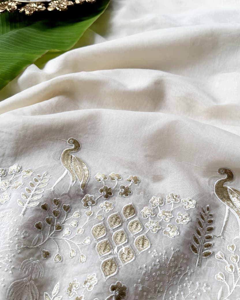 off-white Mul Chanderi showing decorative embroidered border and refined Chanderi texture