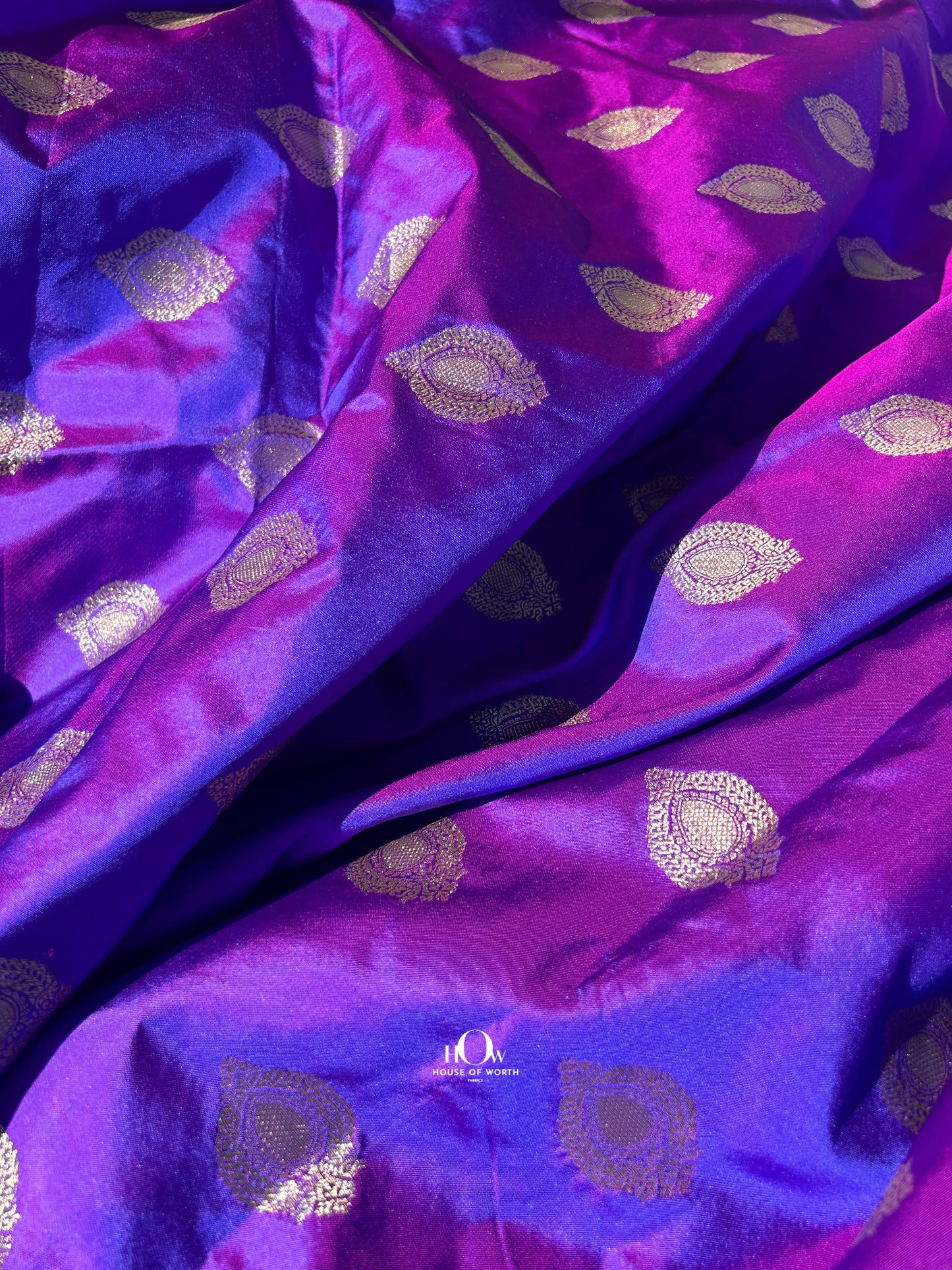 Festive Banarasi silk lehenga from Varanasi in bright red, ideal for weddings & festivals.