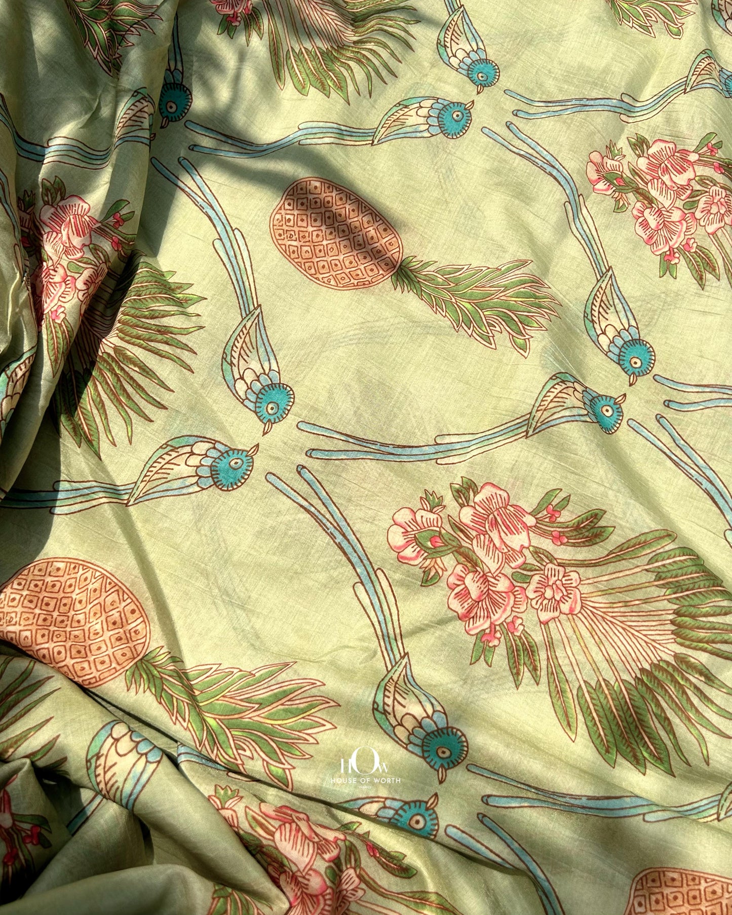 Printed Mul Chanderi fabric in pastel green with tropical leaf design – perfect for salwar suits and ethnic wear.
