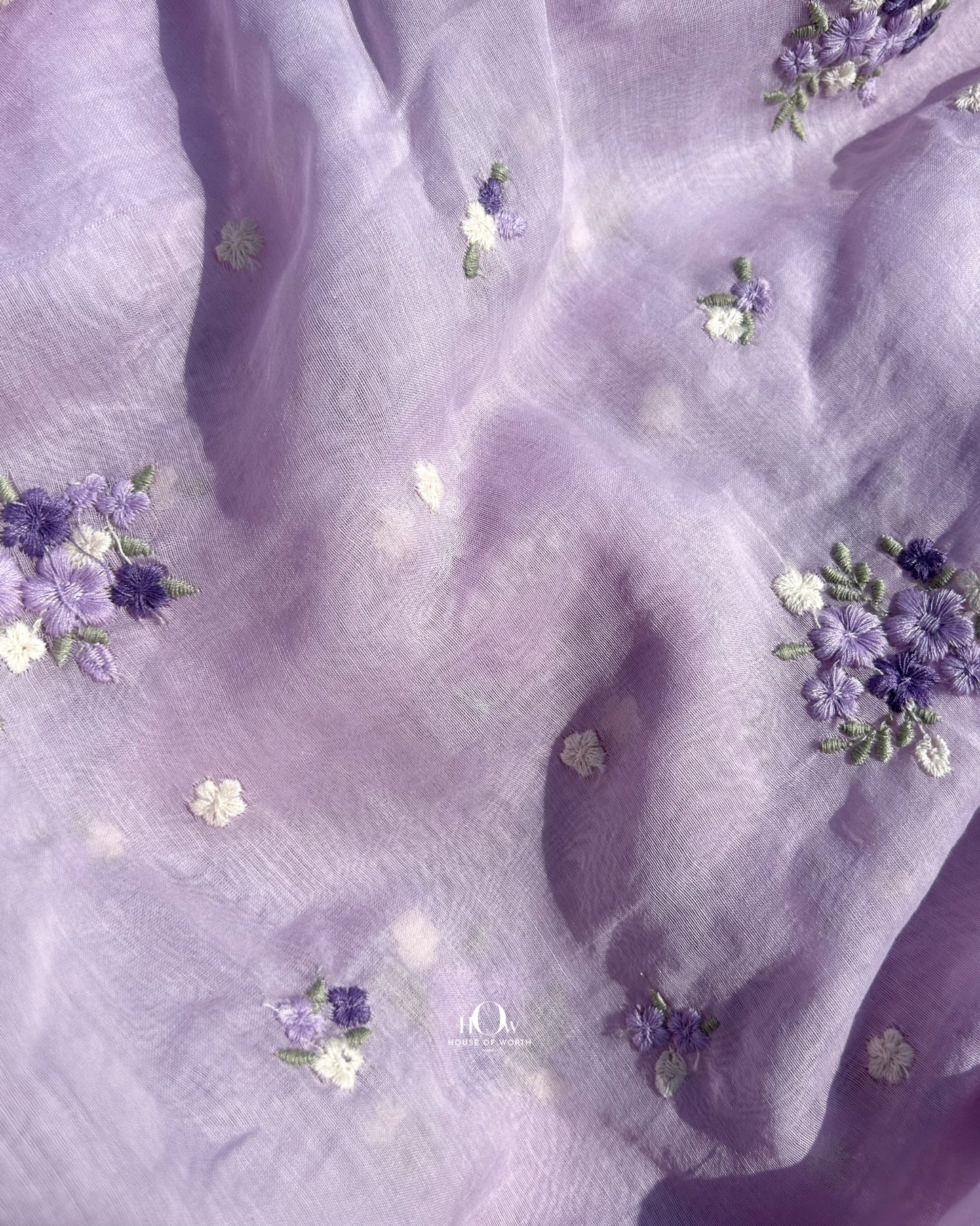 Mul Chanderi fabric supplier Delhi – soft lavender fabric with floral embroidery for wholesale and retail orders.