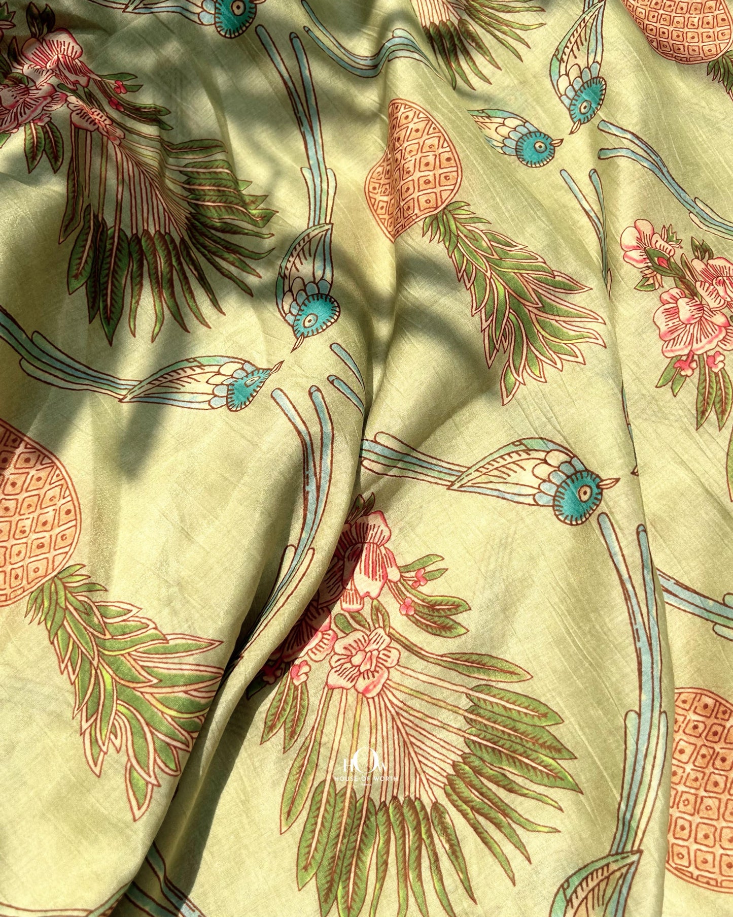 Leaf print Chanderi fabric in pastel green – soft handloom fabric for designer sarees and festive suits.