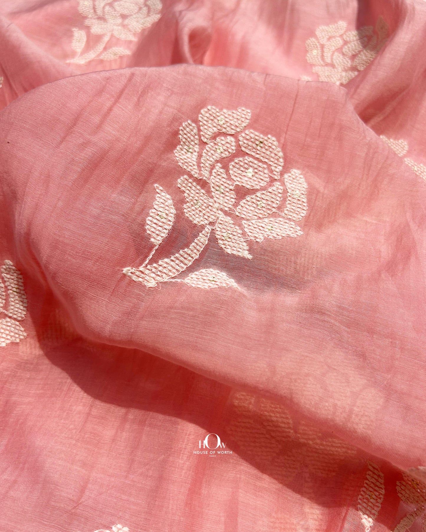 Lightweight peach pink Mul Chanderi fabric with floral embroidery – breathable and ideal for summer Indian wear.