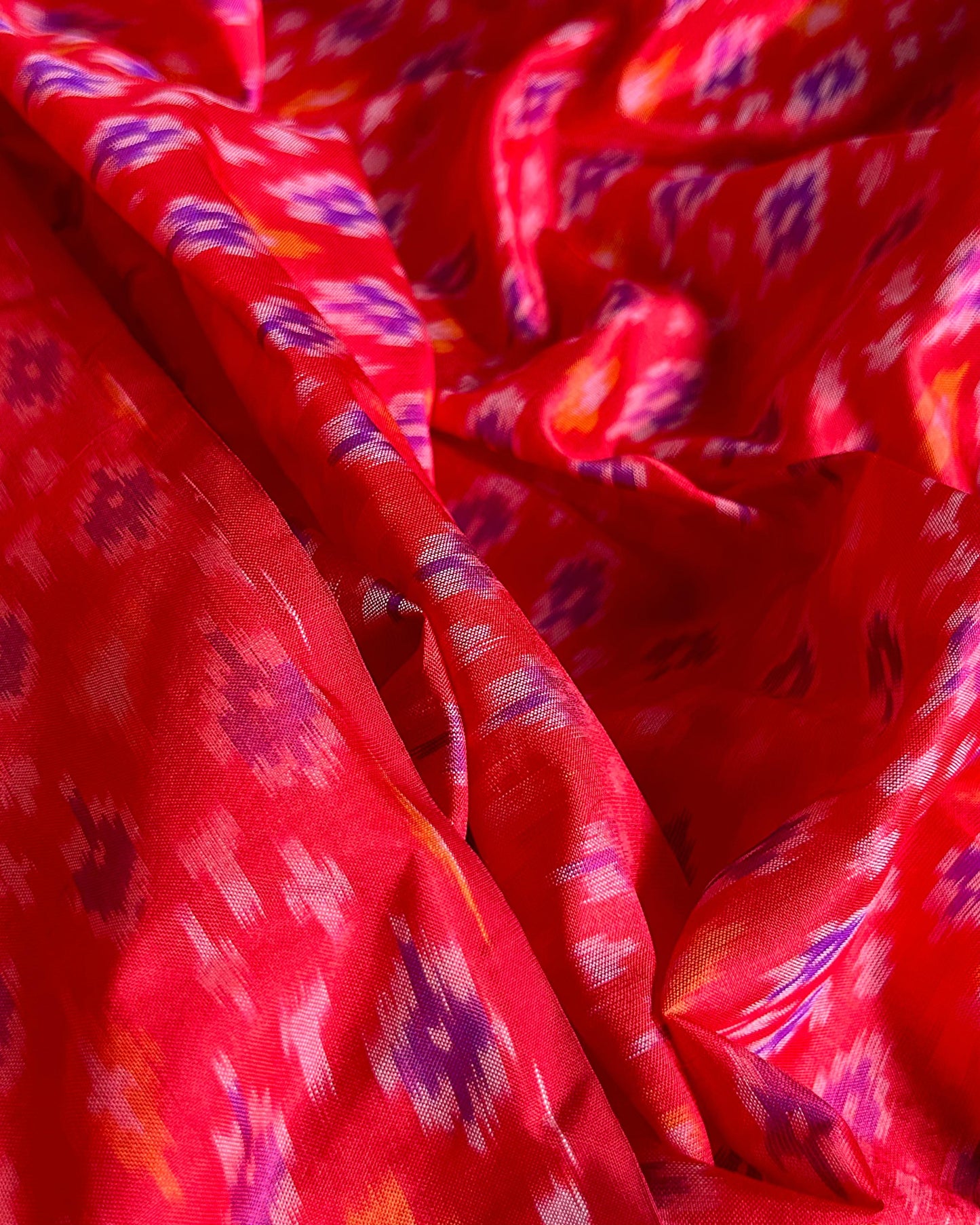 Vibrant pure silk ikat fabric – ideal for sarees and gowns. Ikat silk suppliers in mumbai