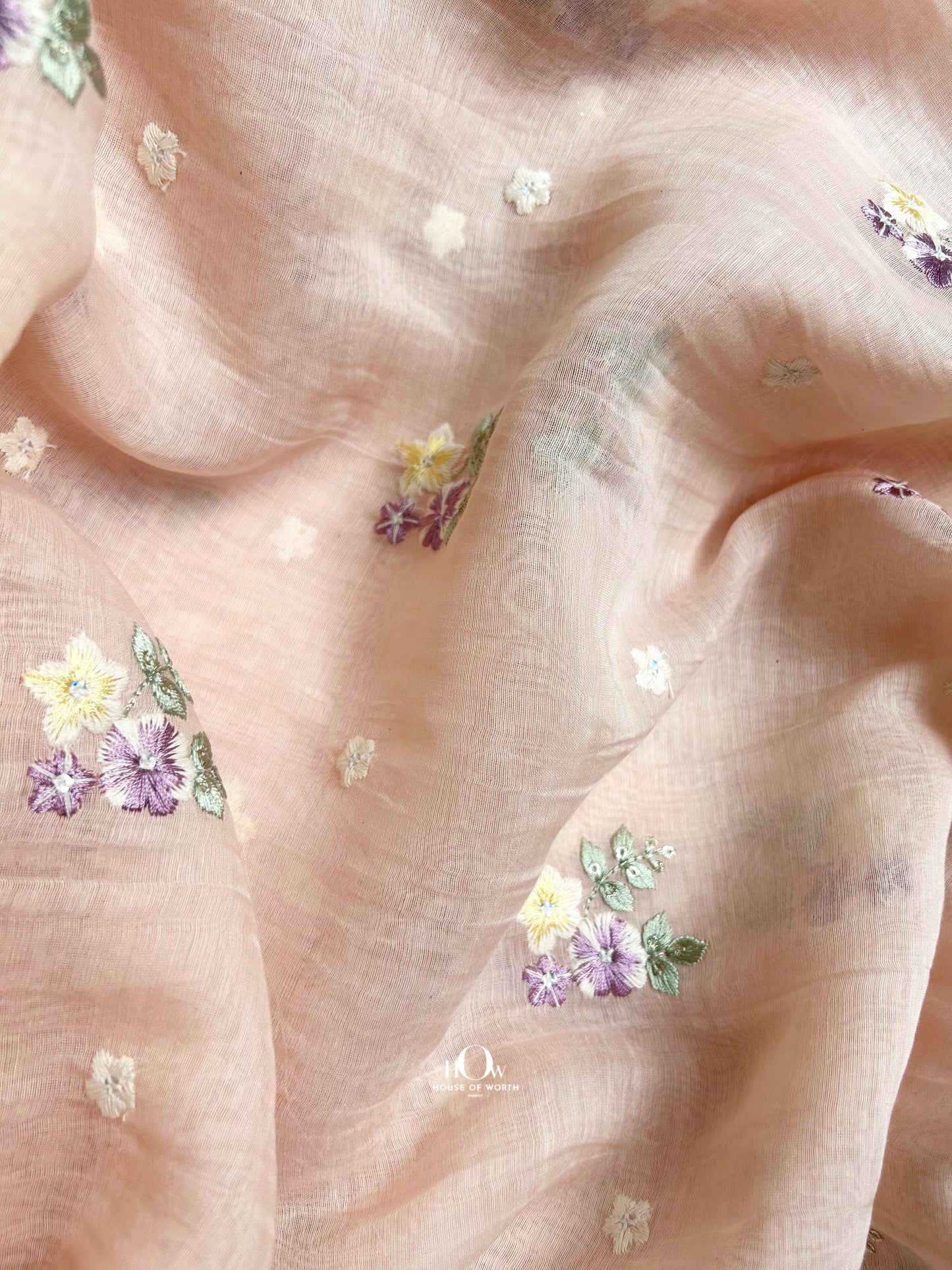 Buy floral embroidered Mul Chanderi dress material – light peach fabric with delicate pastel motifs for retail and wholesale.