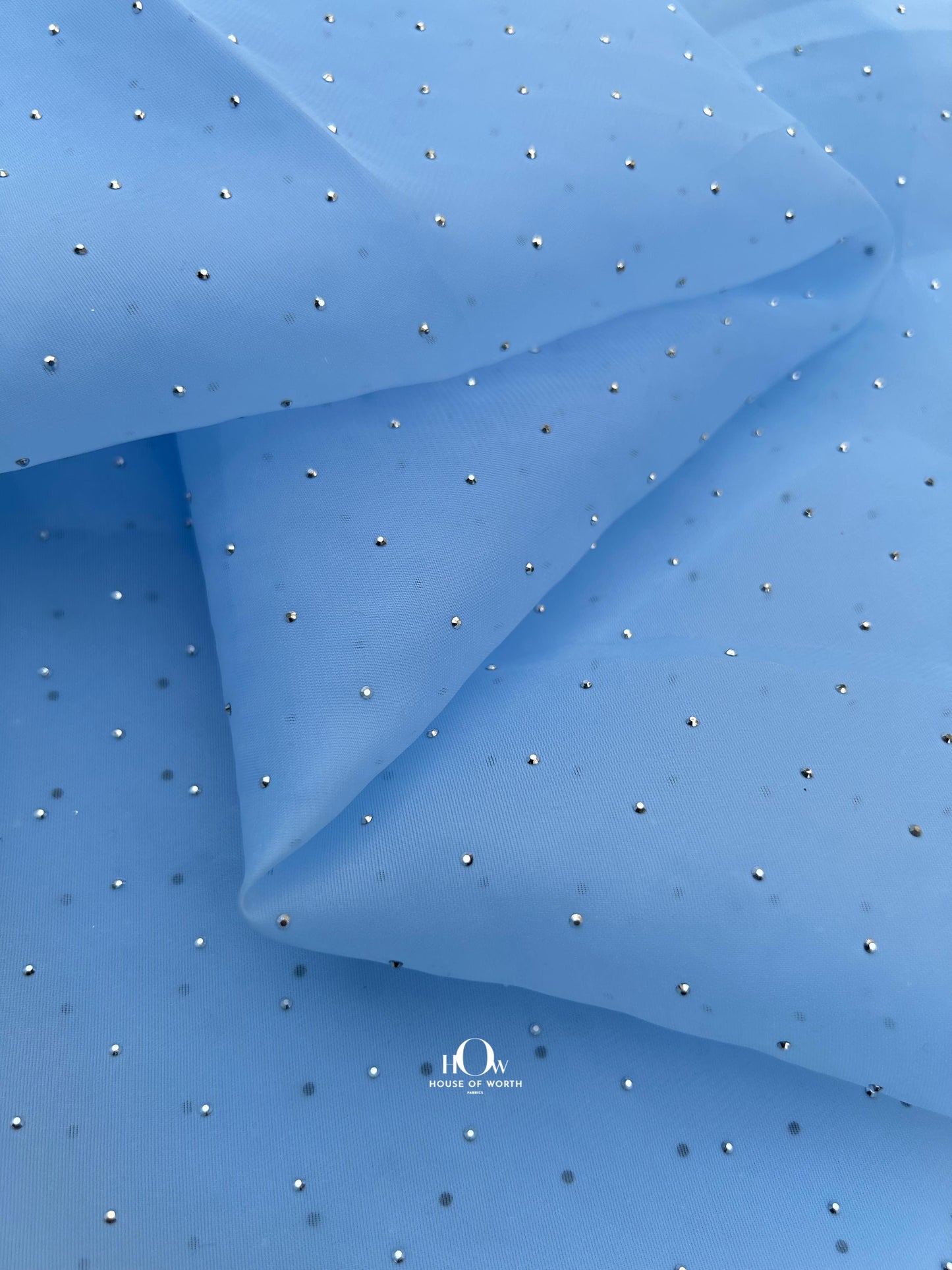 Imported shimmer organza net fabric for partywear in Bhiwandi, elegant designs.