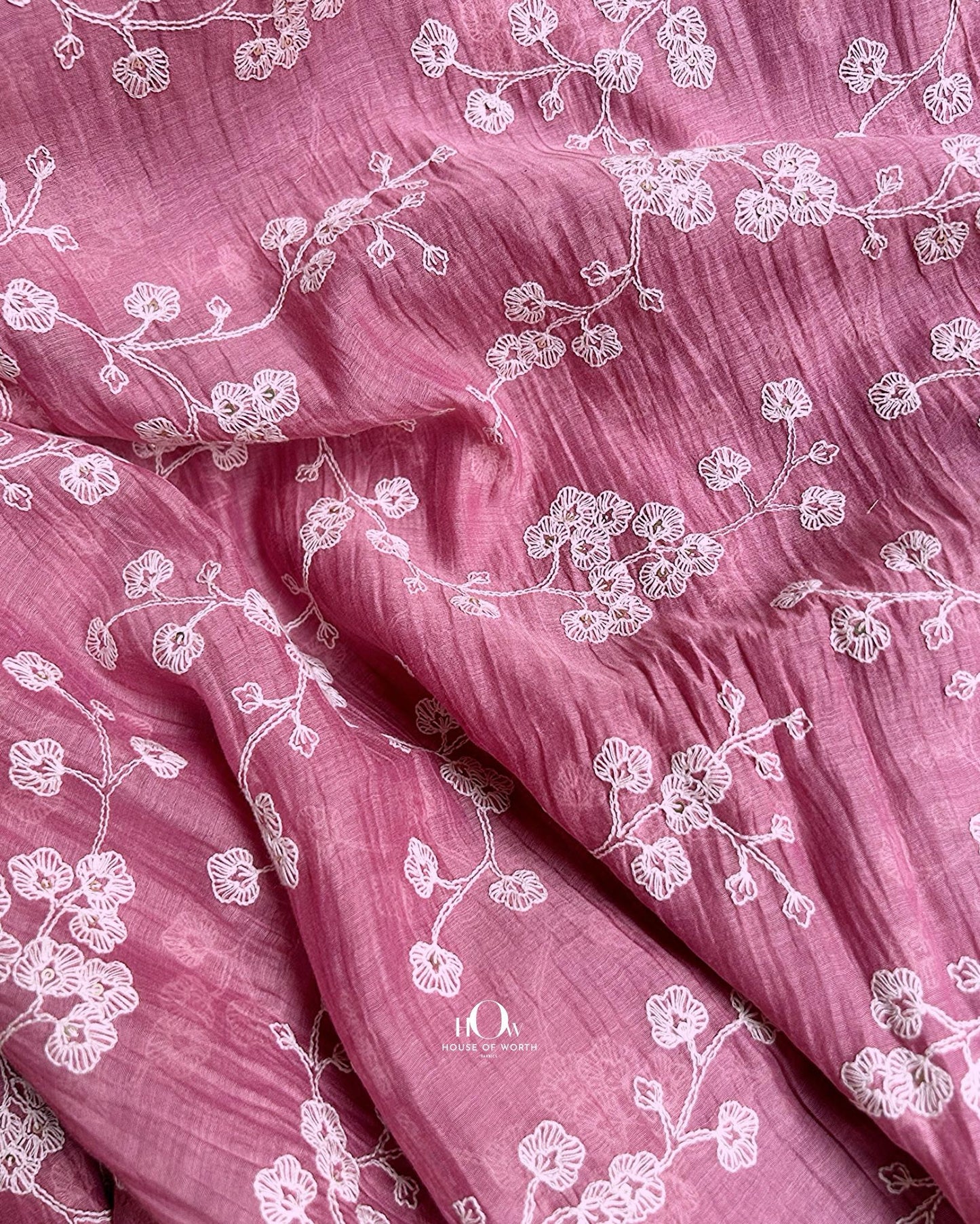 Mul Chanderi fabric wholesaler in Surat offering pink embroidered material for festive wear and ethnic tailoring.
