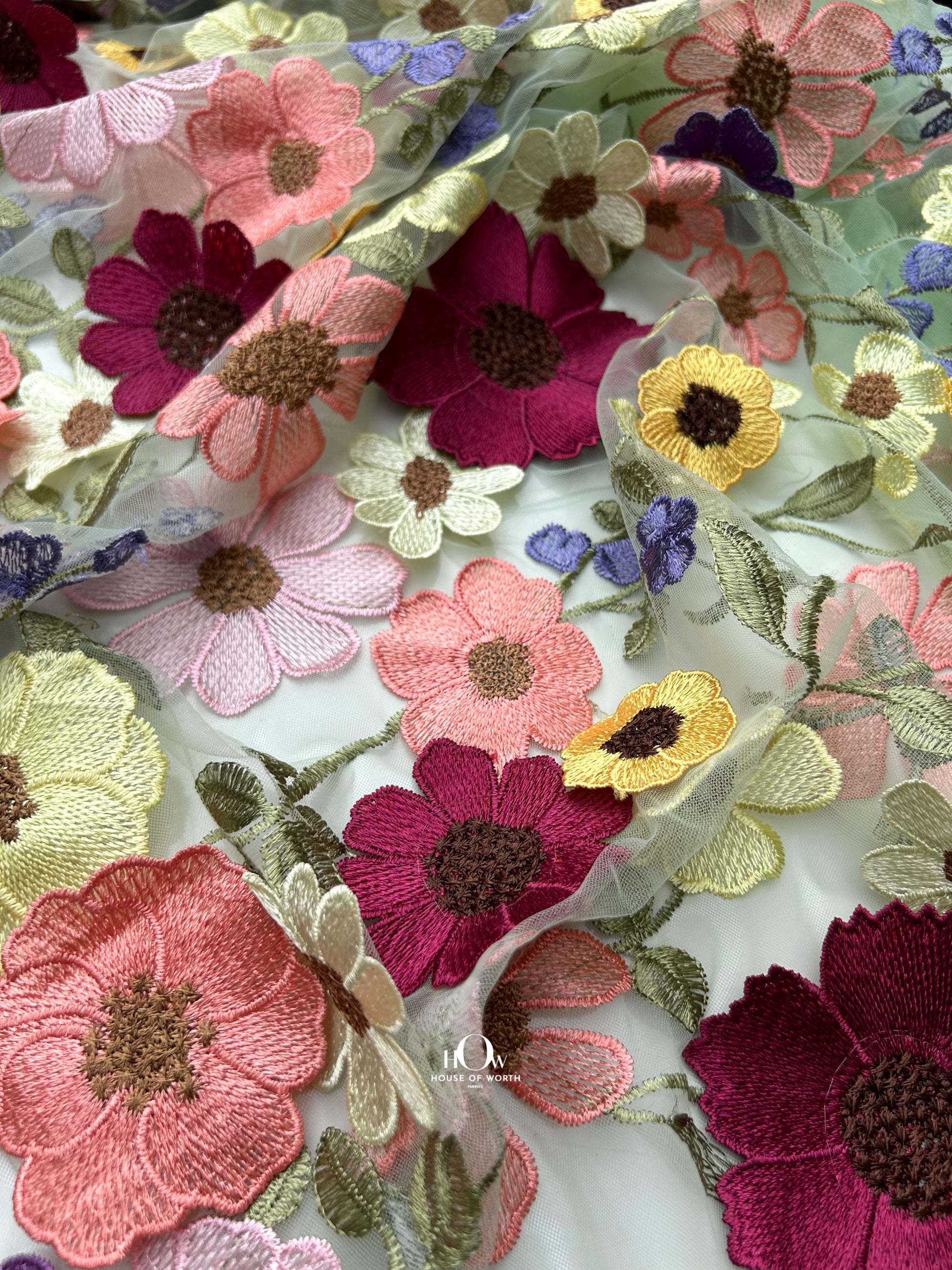 Imported floral appliqué embroidered fabric – luxury bridal gown material.