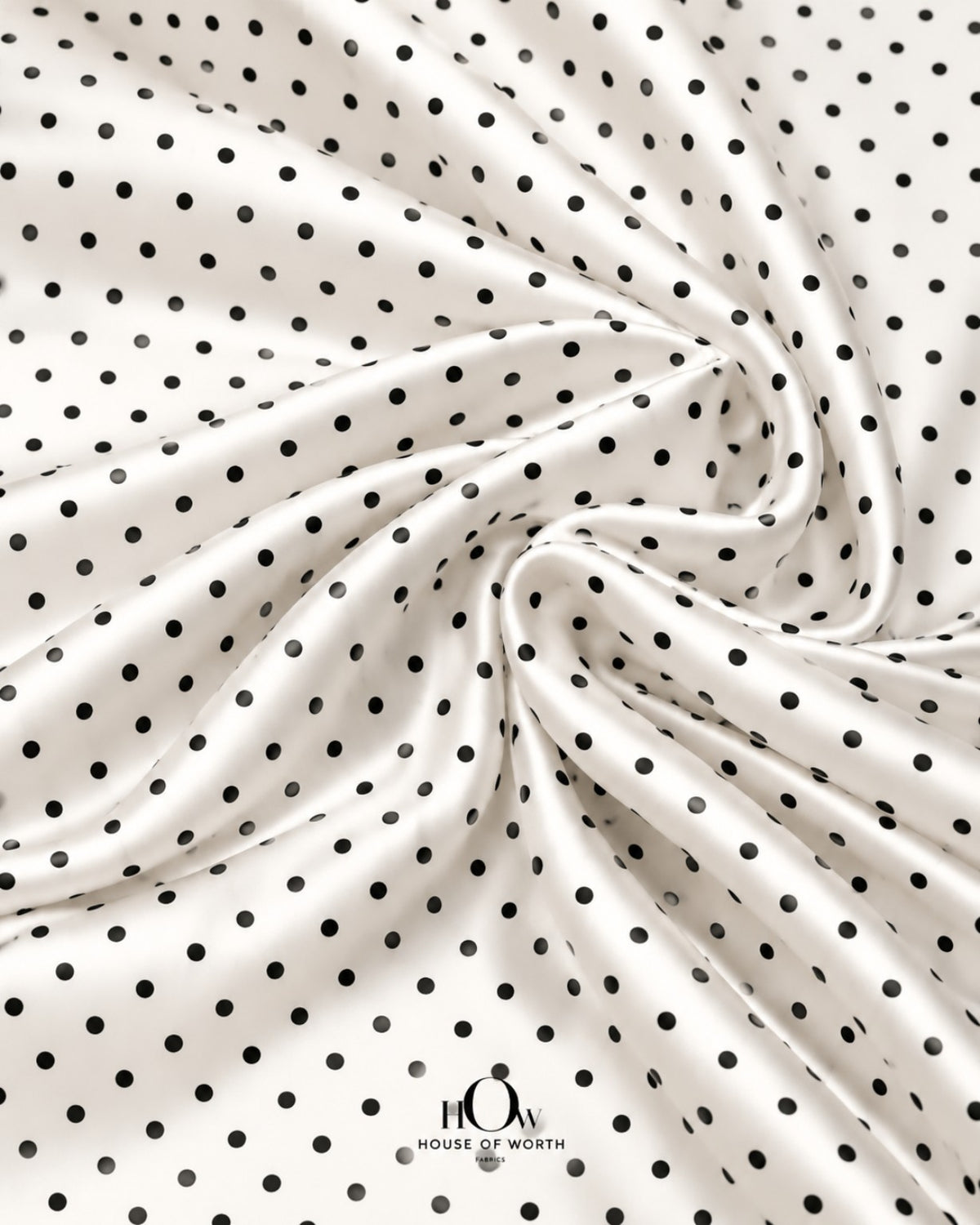 White and black polka dot satin suited to dresses, skirts, blouses and co-ord sets
