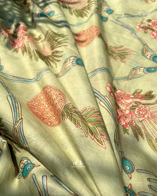 Pastel green Mul Chanderi fabric with leaf print – lightweight and elegant fabric for sarees and kurtis.