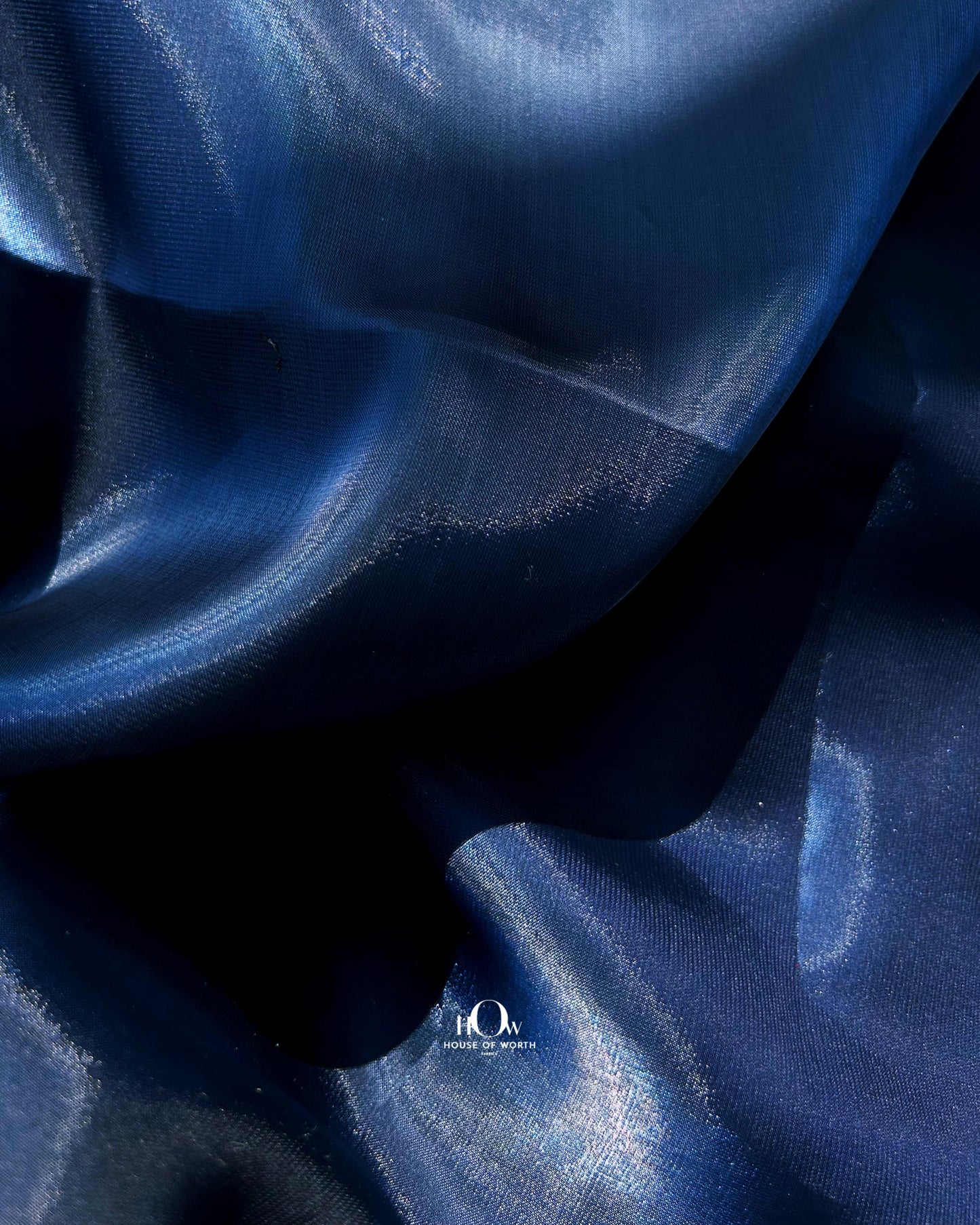 Organza IL material ideal for bridal gowns and festive dresses – sourced from Surat wholesalers.