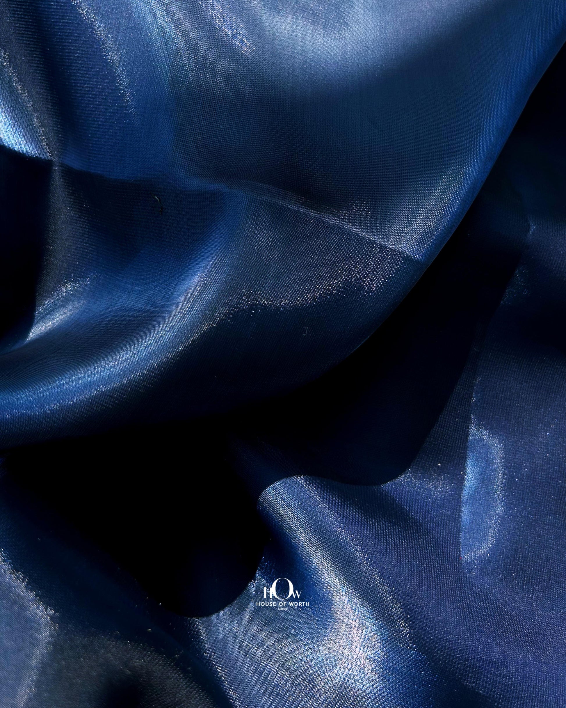 Organza IL material ideal for bridal gowns and festive dresses – sourced from Surat wholesalers.