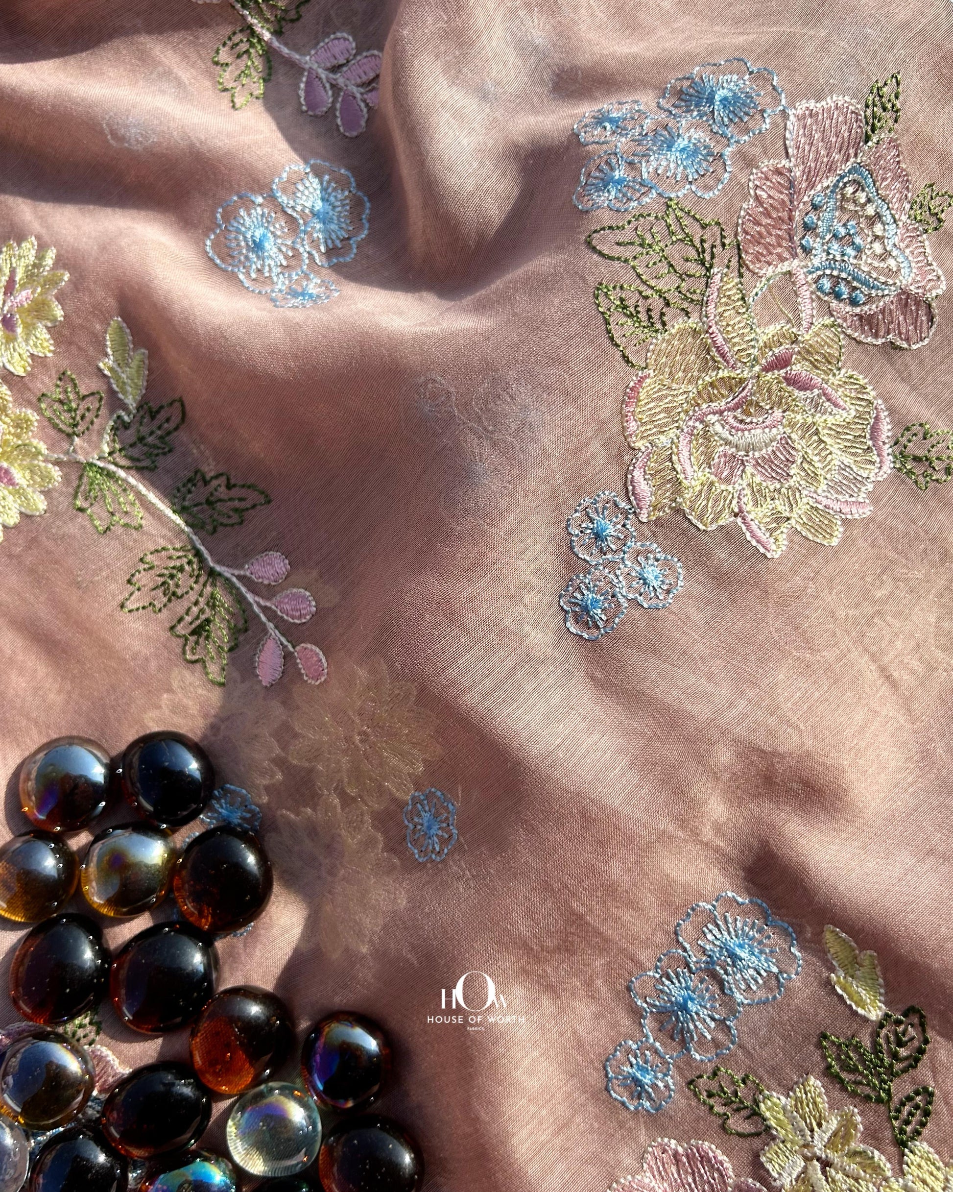 Pure Mul Chanderi fabric in brown with multicolor floral embroidery – ideal for sarees, suits, and festive wear.