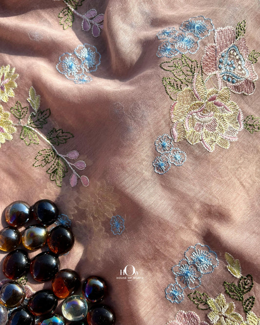 Pure Mul Chanderi fabric in brown with multicolor floral embroidery – ideal for sarees, suits, and festive wear.
