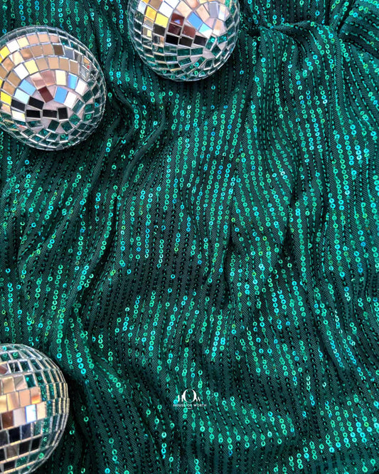 Imported green sequins fabric for partywear western dresses – available in Delhi and Surat.