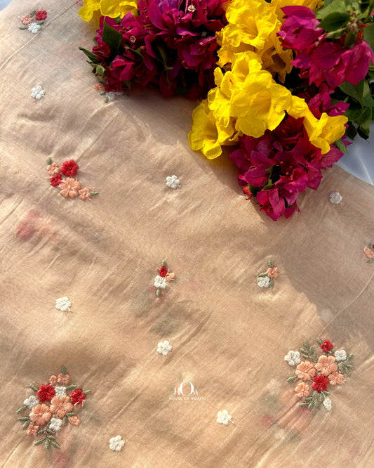 Pure Mul Chanderi fabric with floral butti embroidery – soft light orange fabric for sarees, suits, and festive wear.