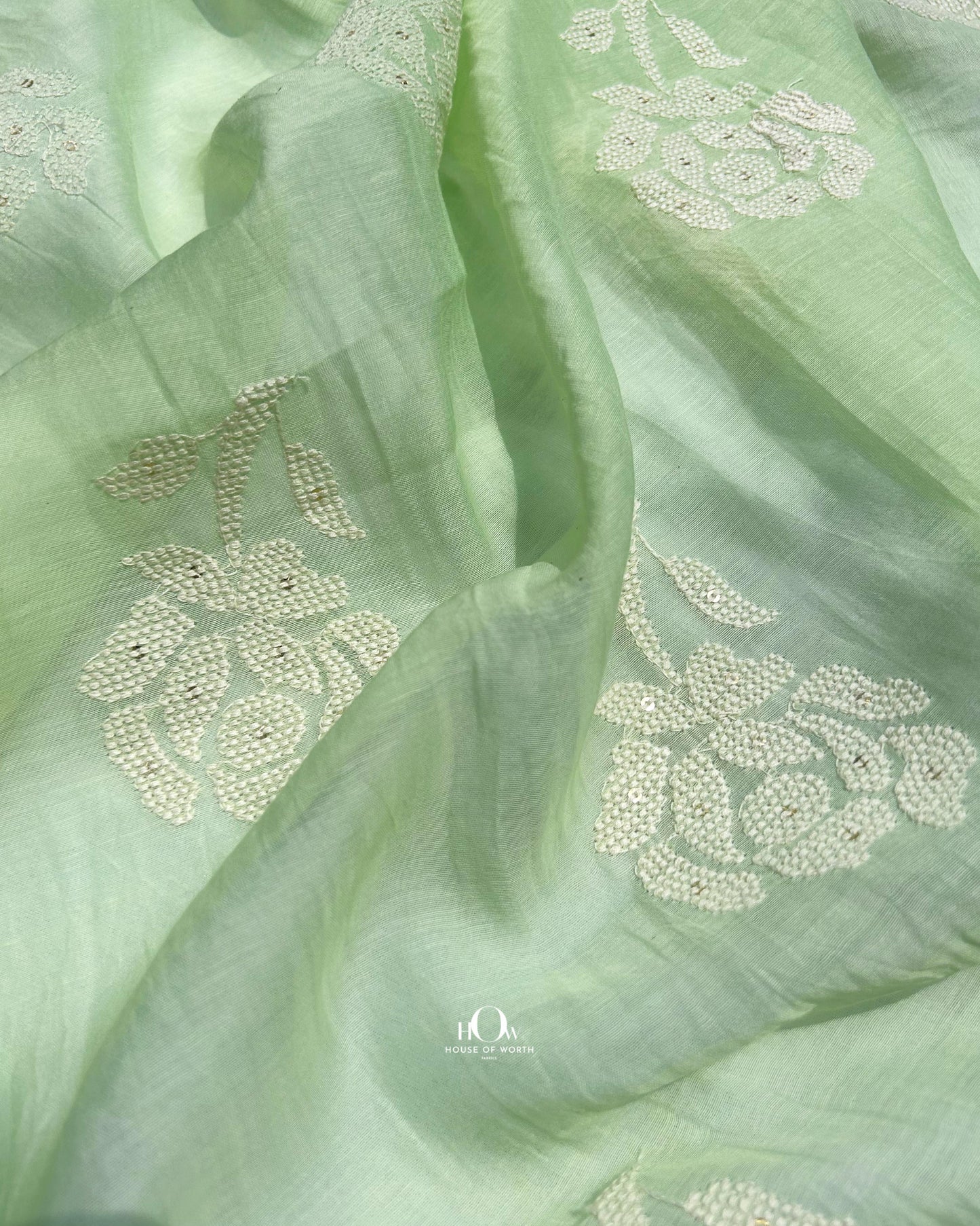 Embroidered green Mul Chanderi fabric for sarees and festive suits – soft, breathable and elegant.
