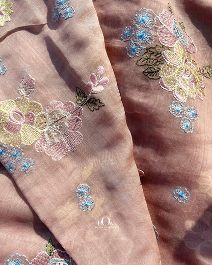 Buy pure Mul Chanderi fabric in bulk – soft handloom fabric with vibrant thread embroidery for ethnic tailoring.