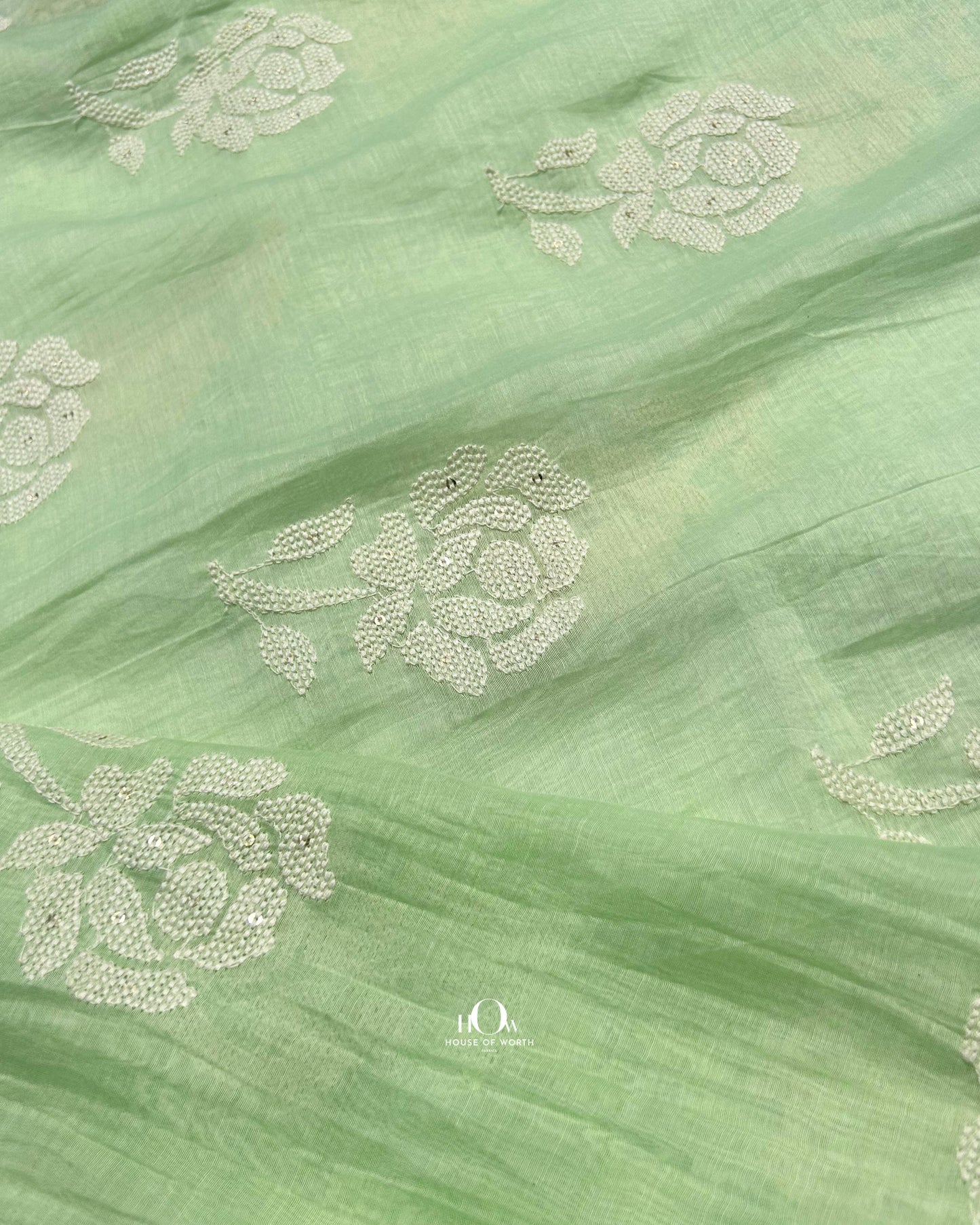 Lightweight handwoven green Mul Chanderi fabric – embroidered textile for premium Indian outfits.