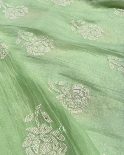 Close-up of Banarasi-inspired embroidery on green Mul Chanderi fabric – perfect for ethnic wear.
