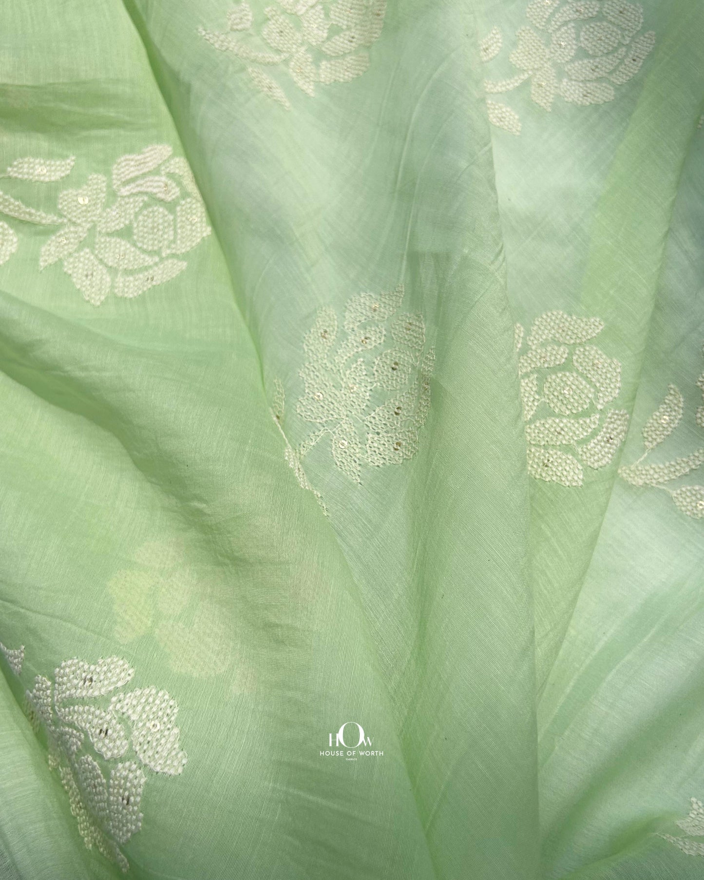 Pure green Mul Chanderi fabric with embroidery for suits and sarees – Banarasi-style handloom textile.