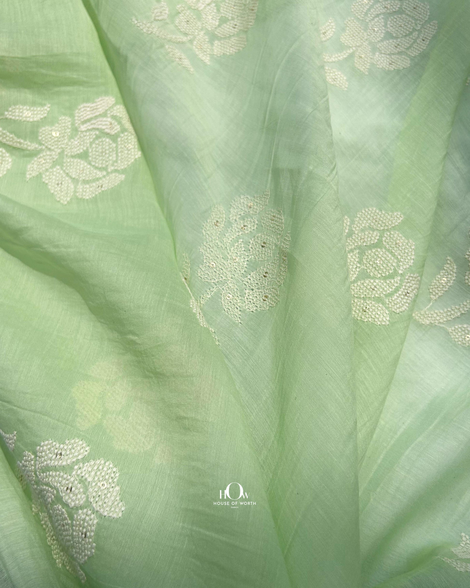 Pure green Mul Chanderi fabric with embroidery for suits and sarees – Banarasi-style handloom textile.